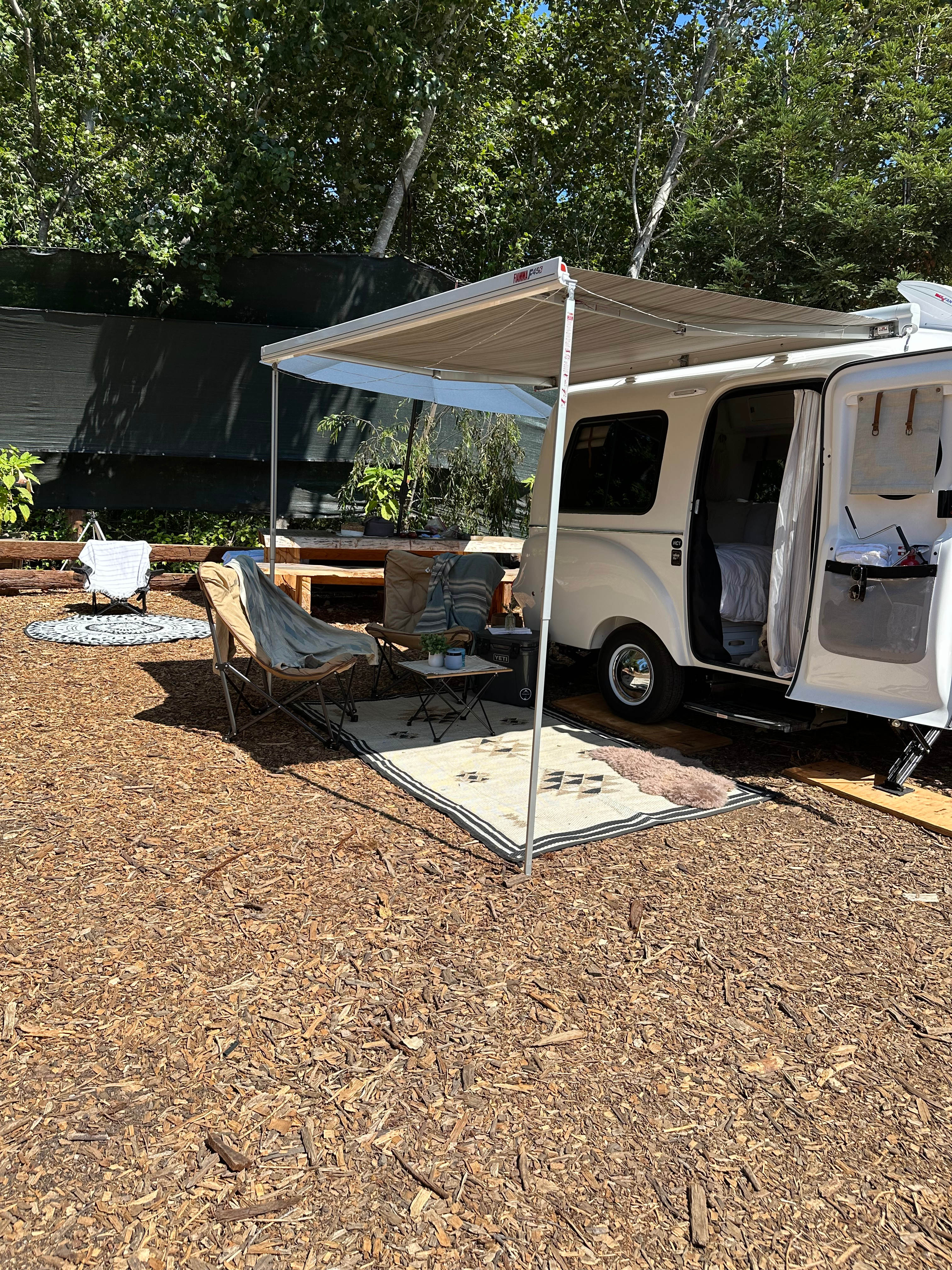Our RV space / right near to one of the outdoor kitchens, bathrooms and showers (THE NICEST EVER!) and one of many communal fire pits. 