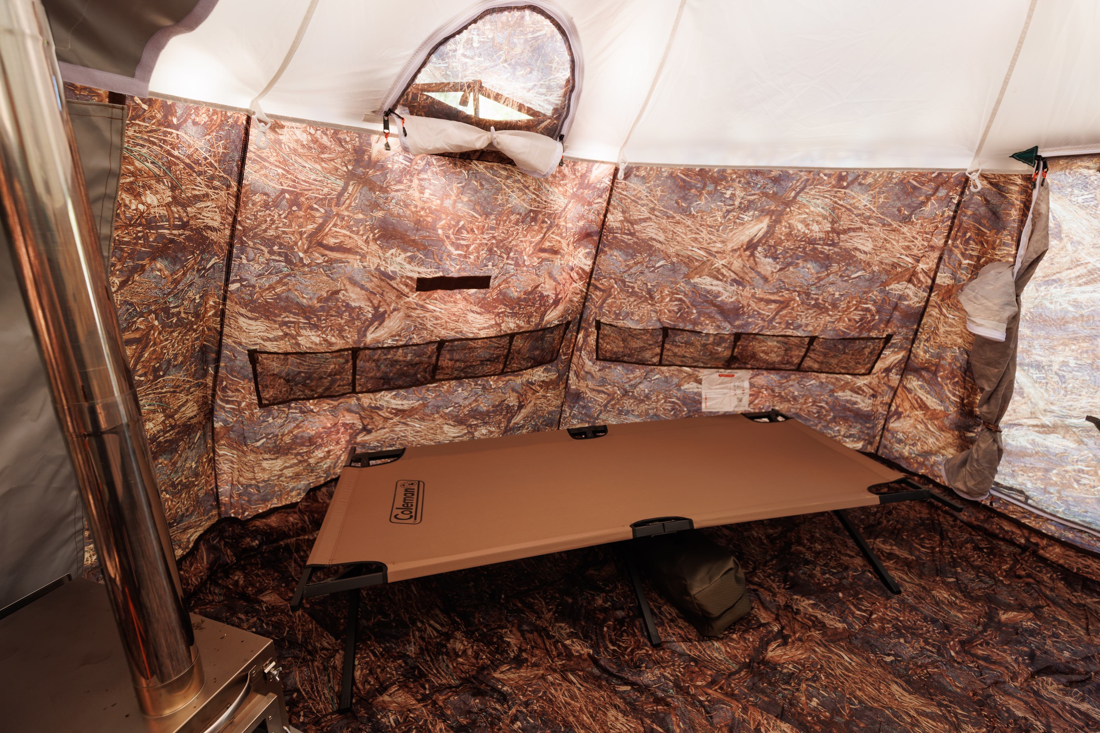 Coleman cot.  Bring your own sleeping pads and sleeping bags.