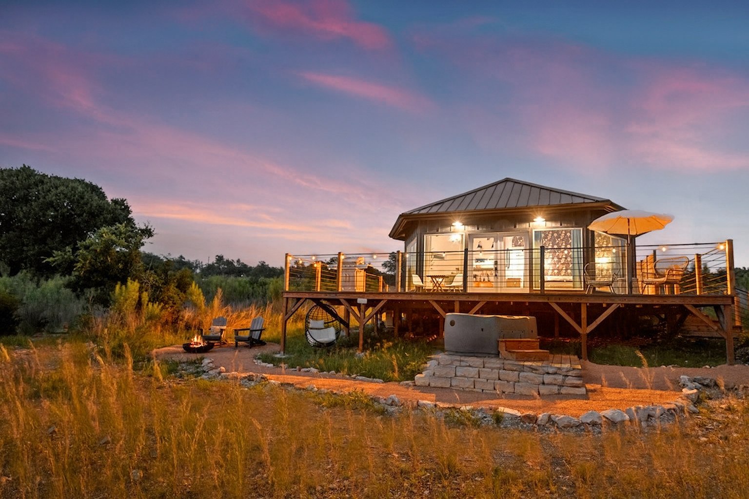 The Hex all-wood yurt is a cozy retreat surrounded by floor-to-ceiling windows. Natural light floods the space and showcases nature and wildlife.