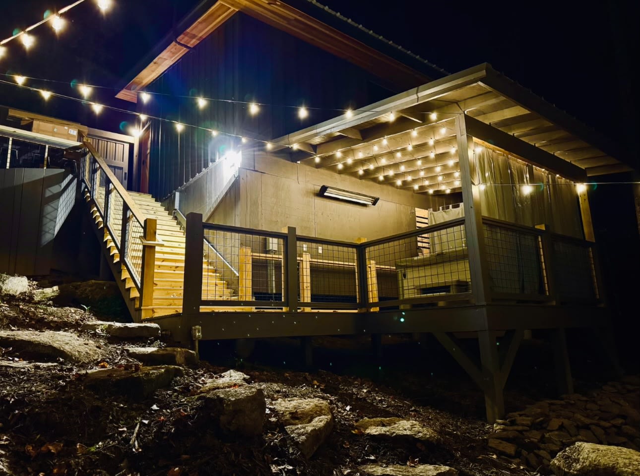 night time view from the woods which look up to the glamping deck