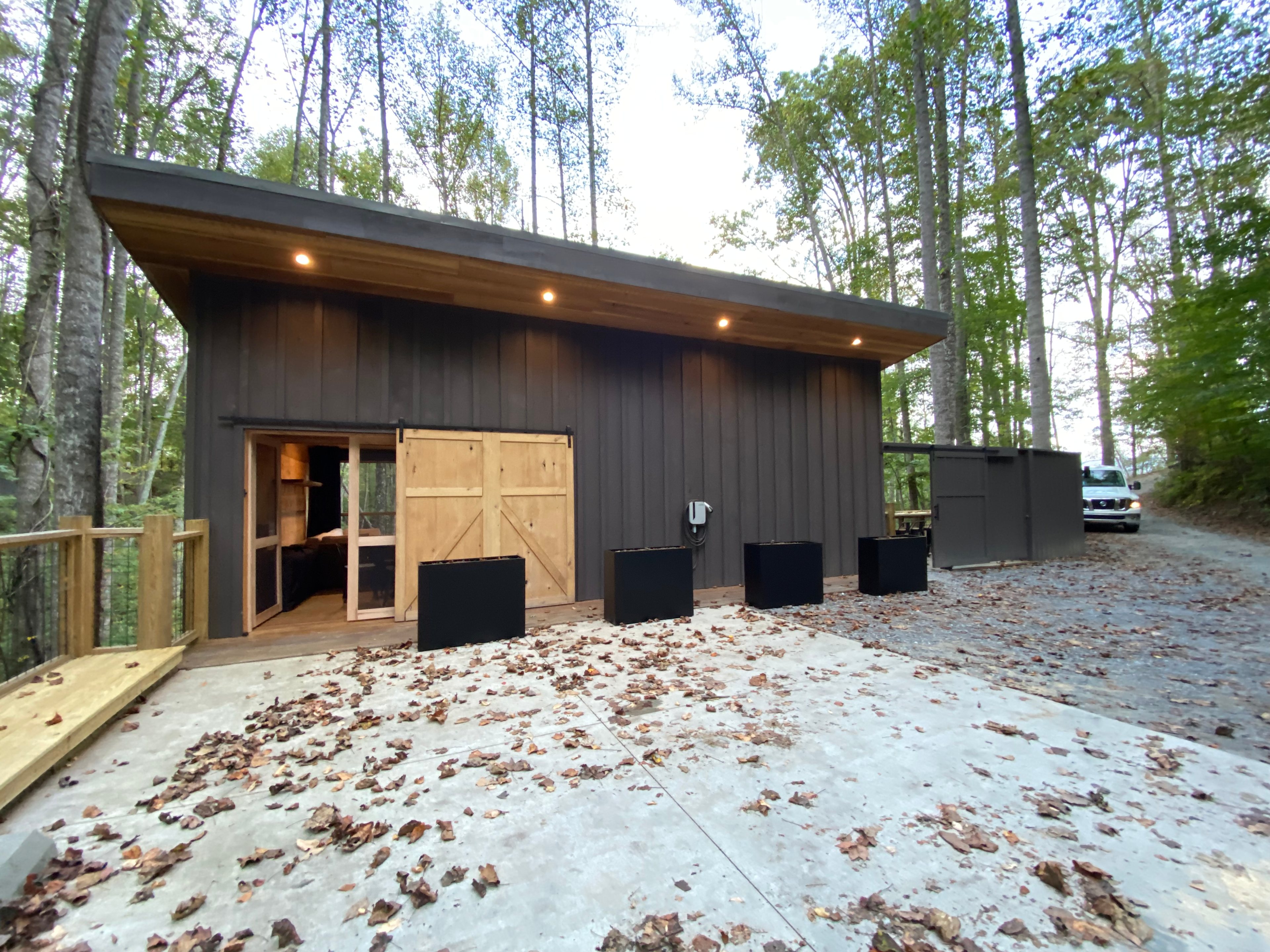 Sliding Barn door on the front with screen doors behind to let the air floor throughout the deck