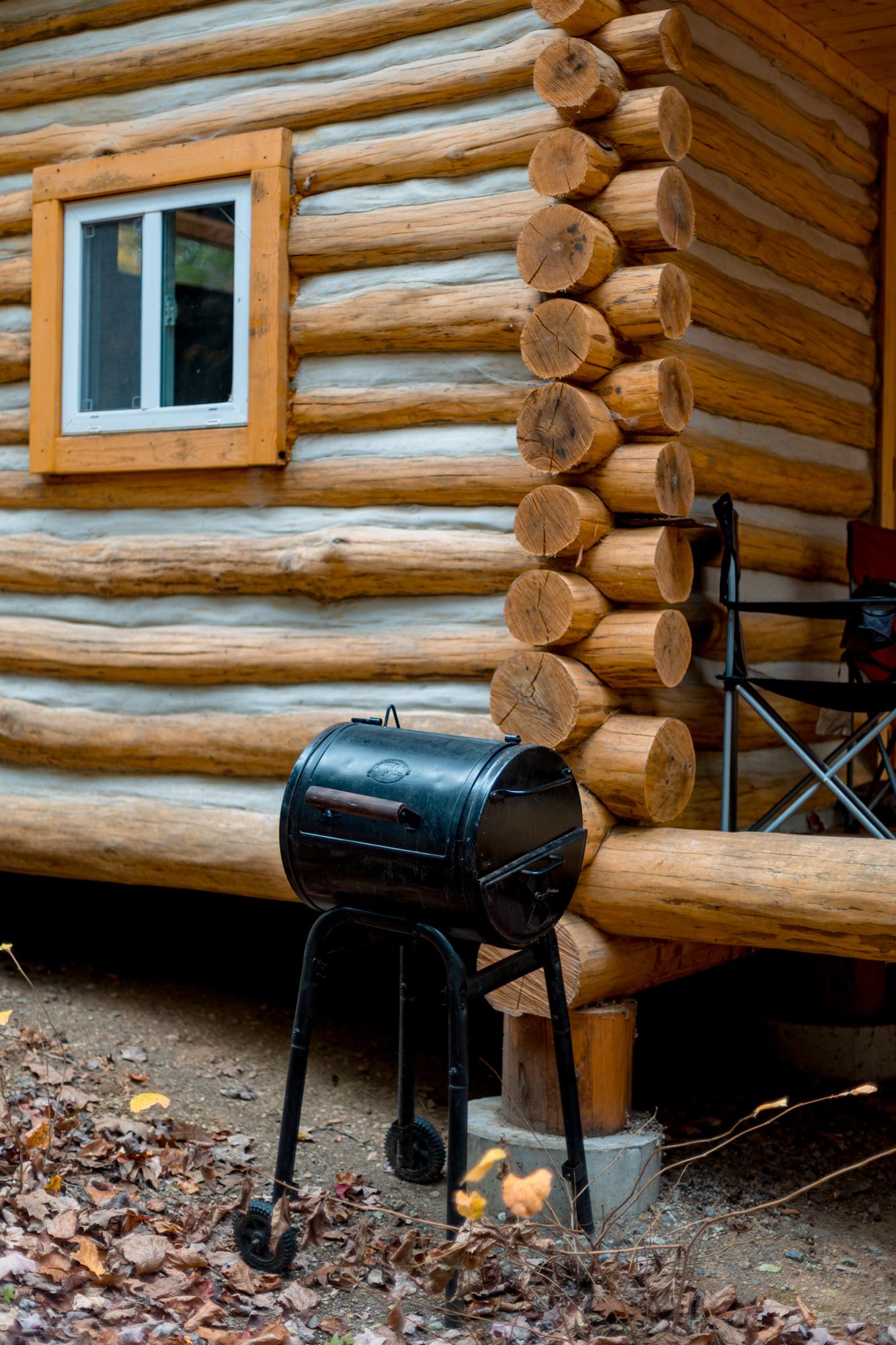 Charcoal grill available to you at both cabins