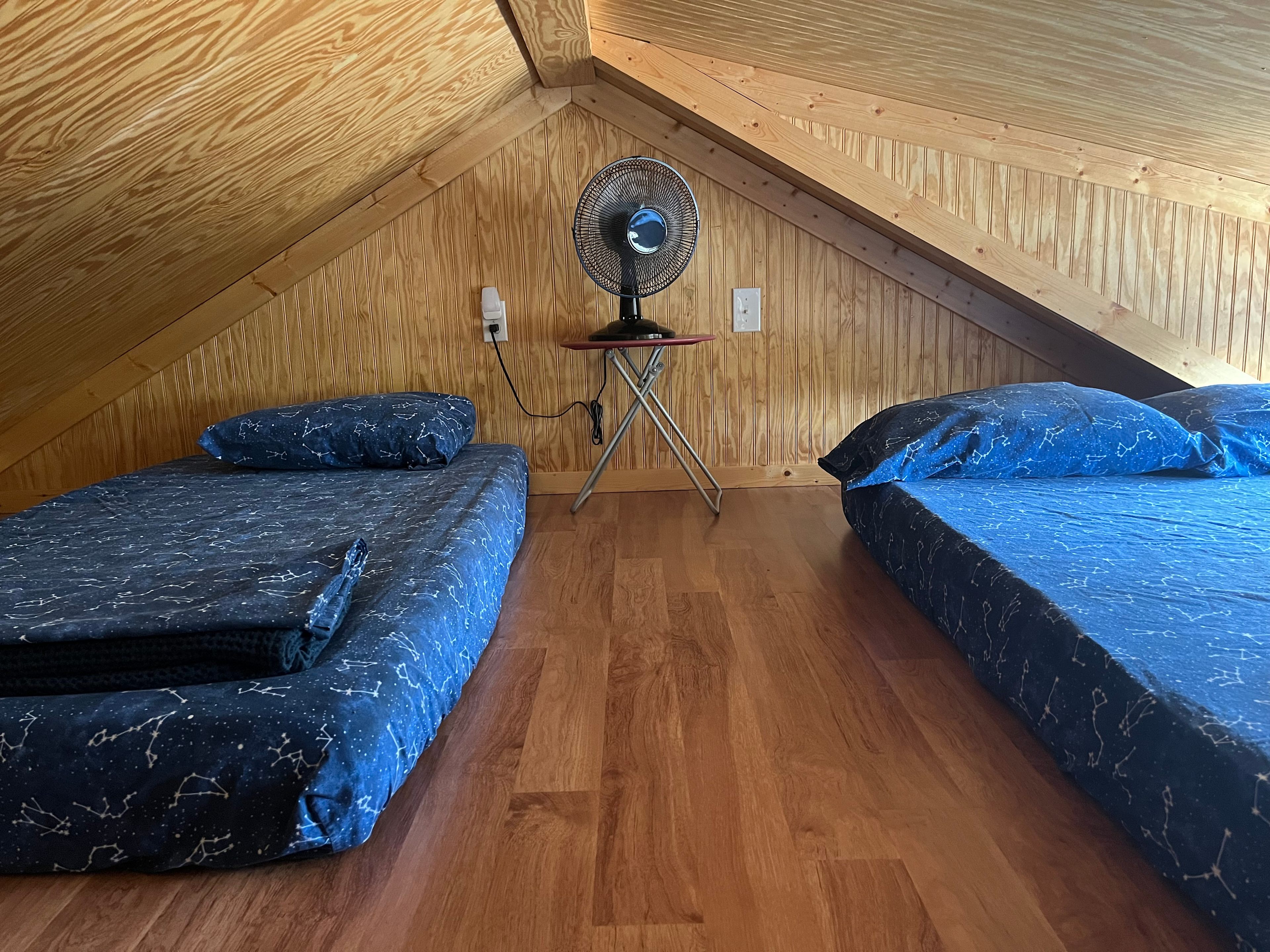 Twin and full size mattress on floor in upstairs loft. 