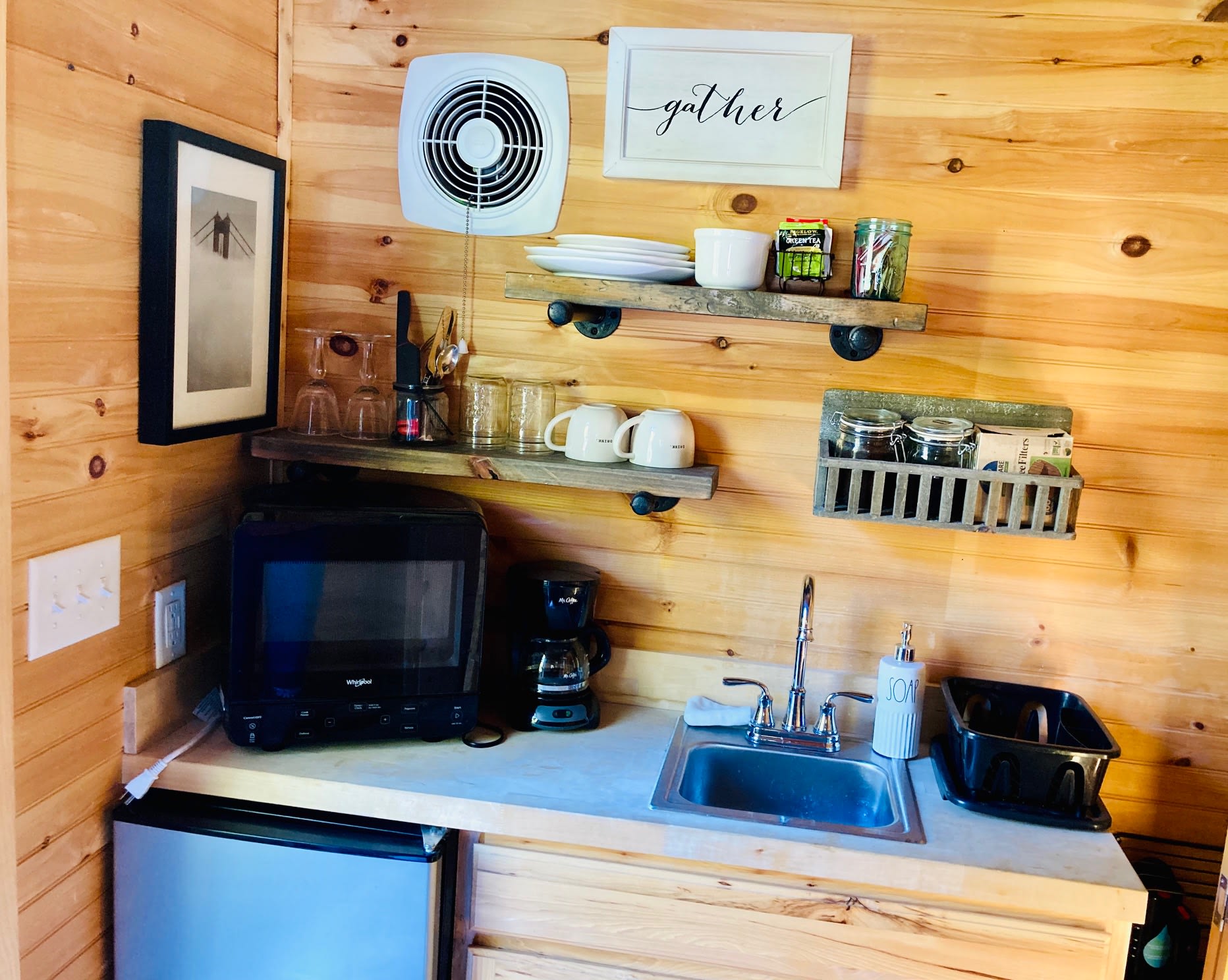  Enjoy a cup of coffee, tea or hot cocoa in the kitchen, which features a mini-fridge/freezer; sink; dishes, glasses, silverware; sugars, honey and creamers, filtered water, and a welcome basket of snacks and local goodies. 