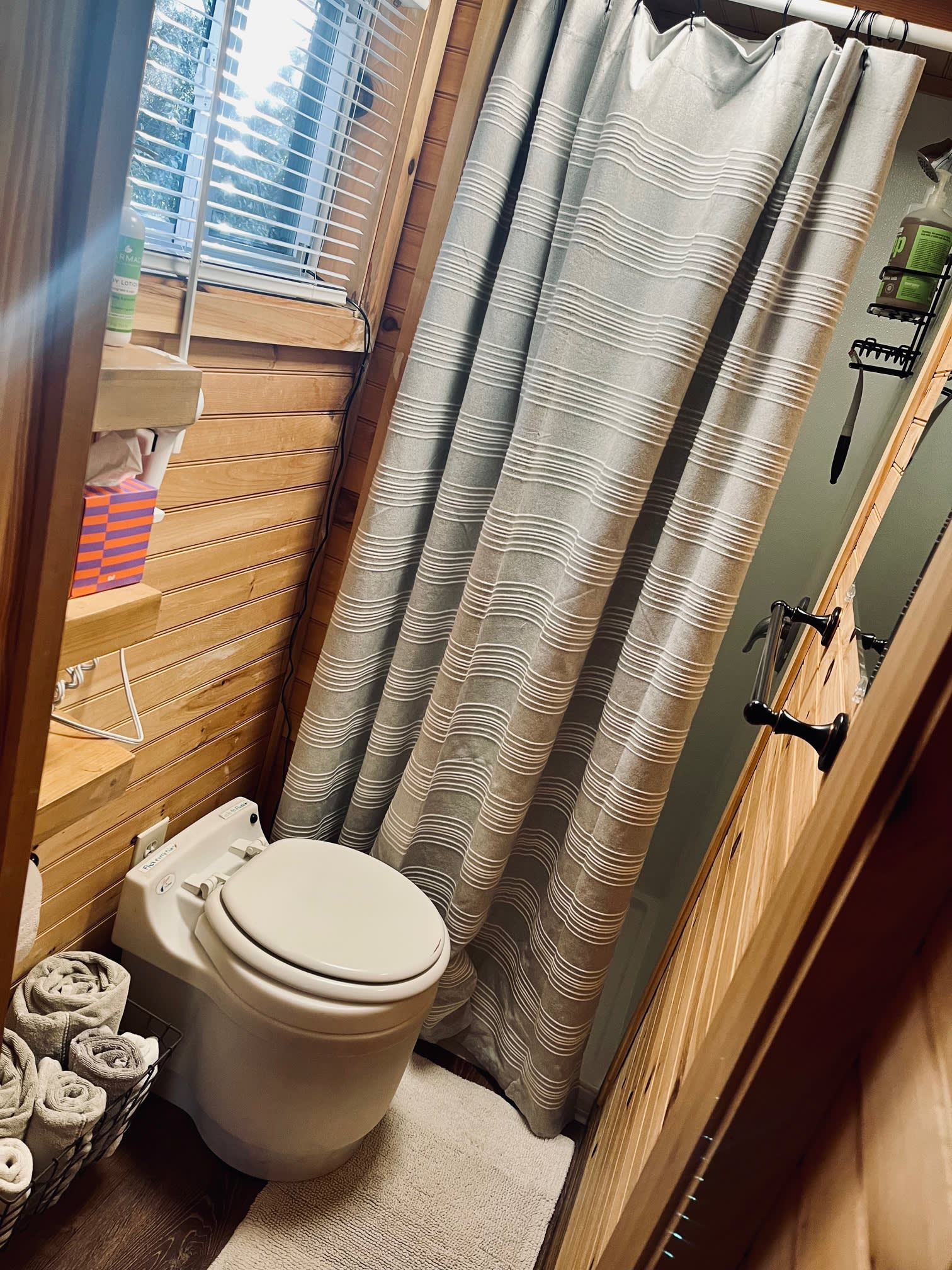 The bathroom has a full shower, dry toilet, hair dryer, 100 percent cotton towels, makeup remover pads, and biodegradable hand, body and hair products. 