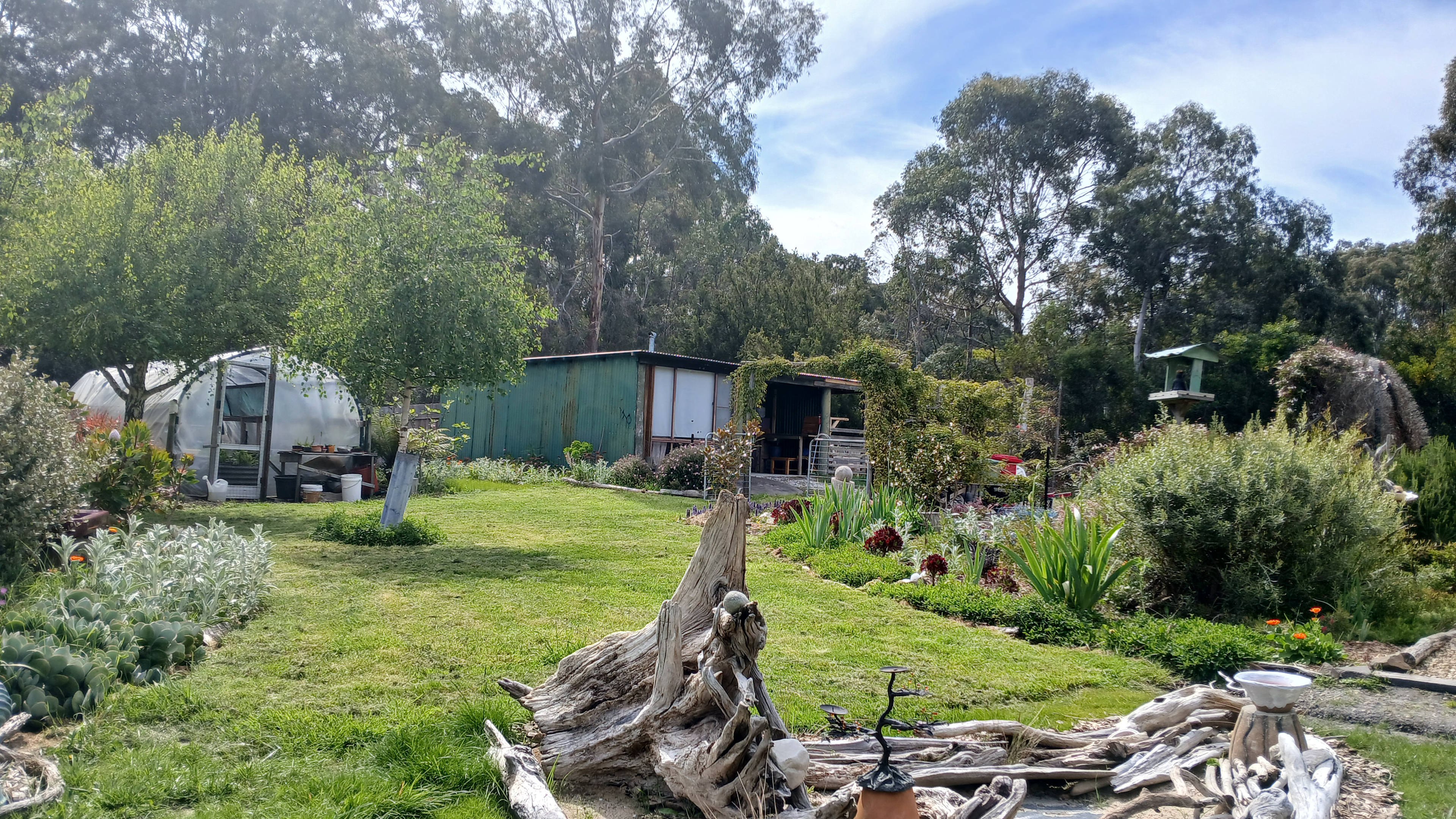 The 'cabin' is a double garage/shed that has been converted into comfortable off-grid living quarters. Prettier on the inside than out!