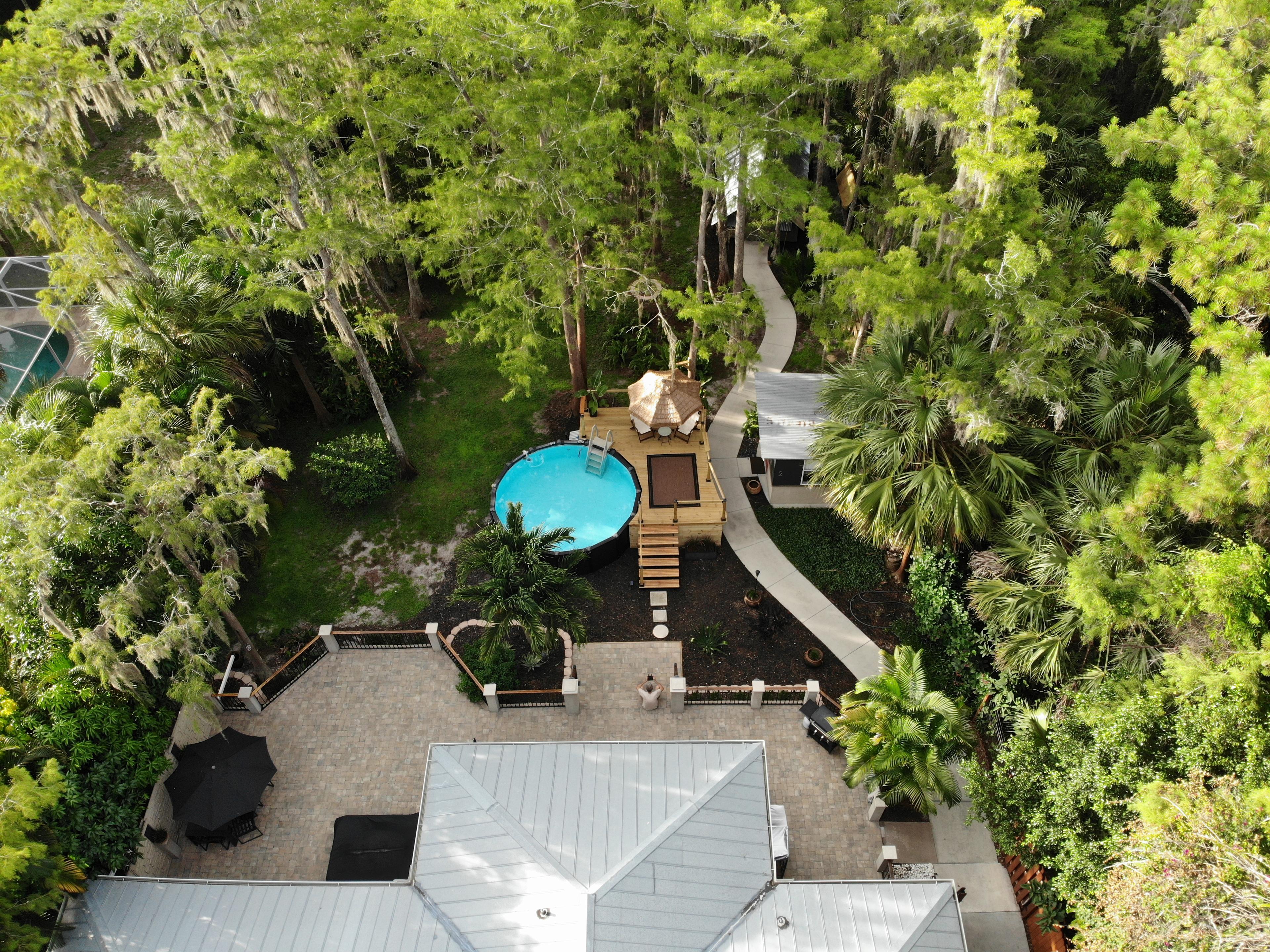 Pool, pool deck and gym are along the cement path leading to the cabin..