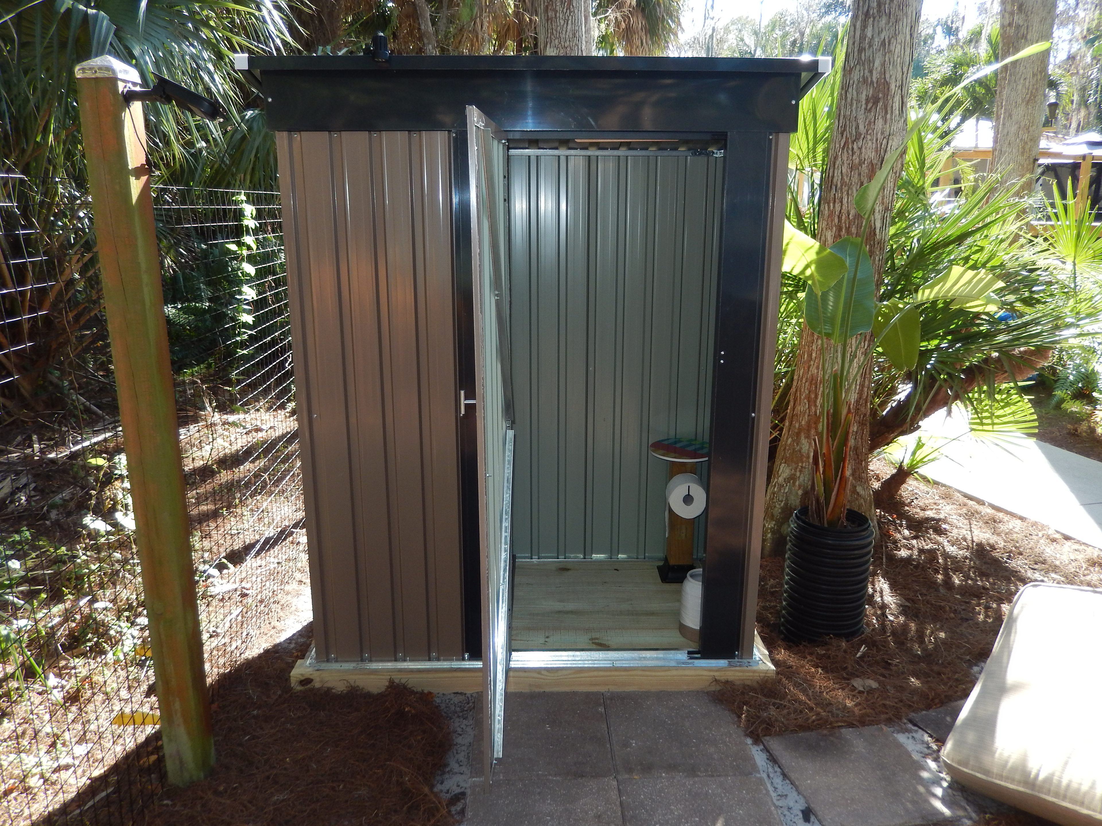 The outhouse and toilet is only a few short steps from the cabin door.
