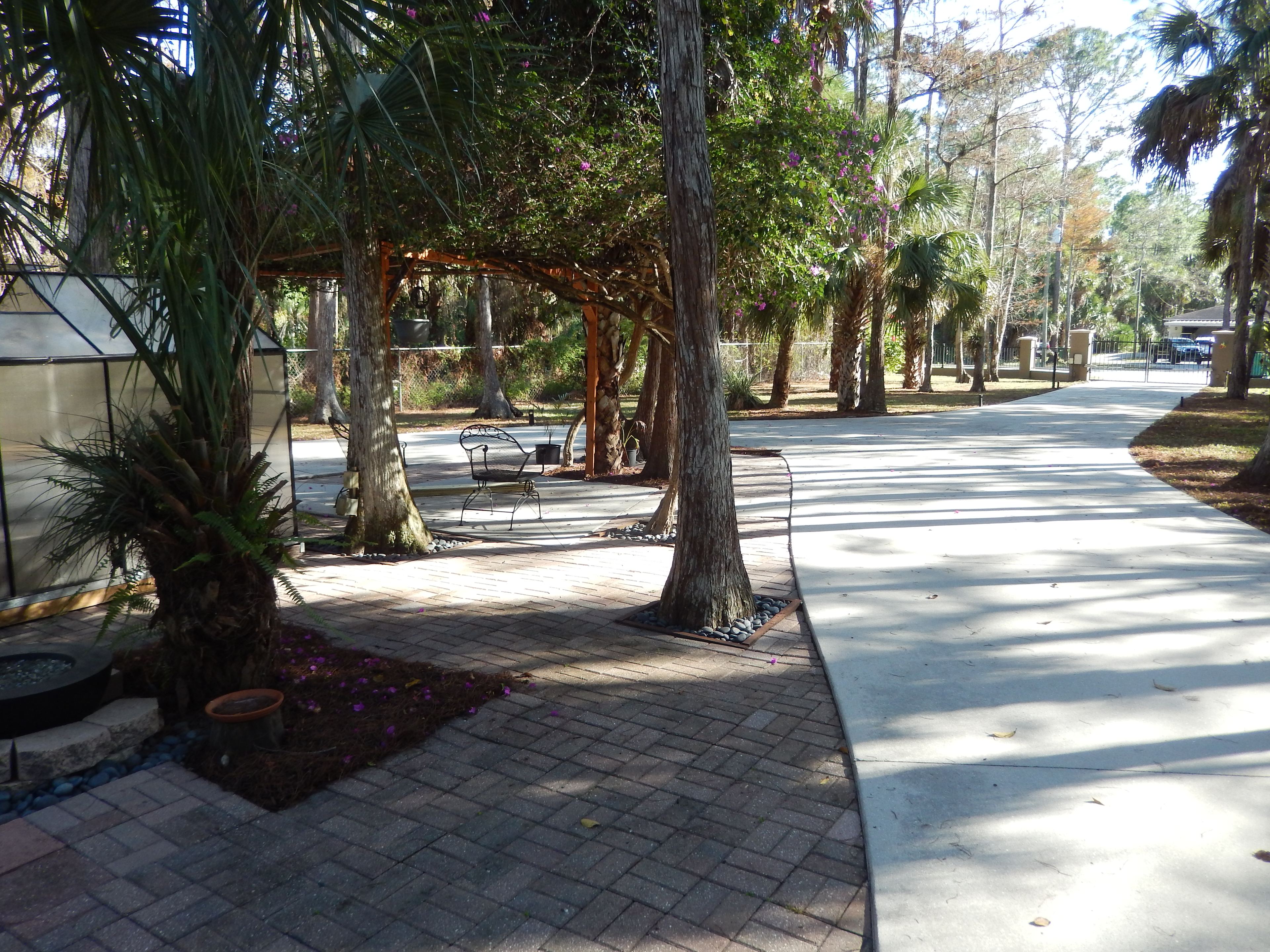 Level cement parking. The pull-through RV site will accommodate most smaller RV's. Larger RV's may require a back out.