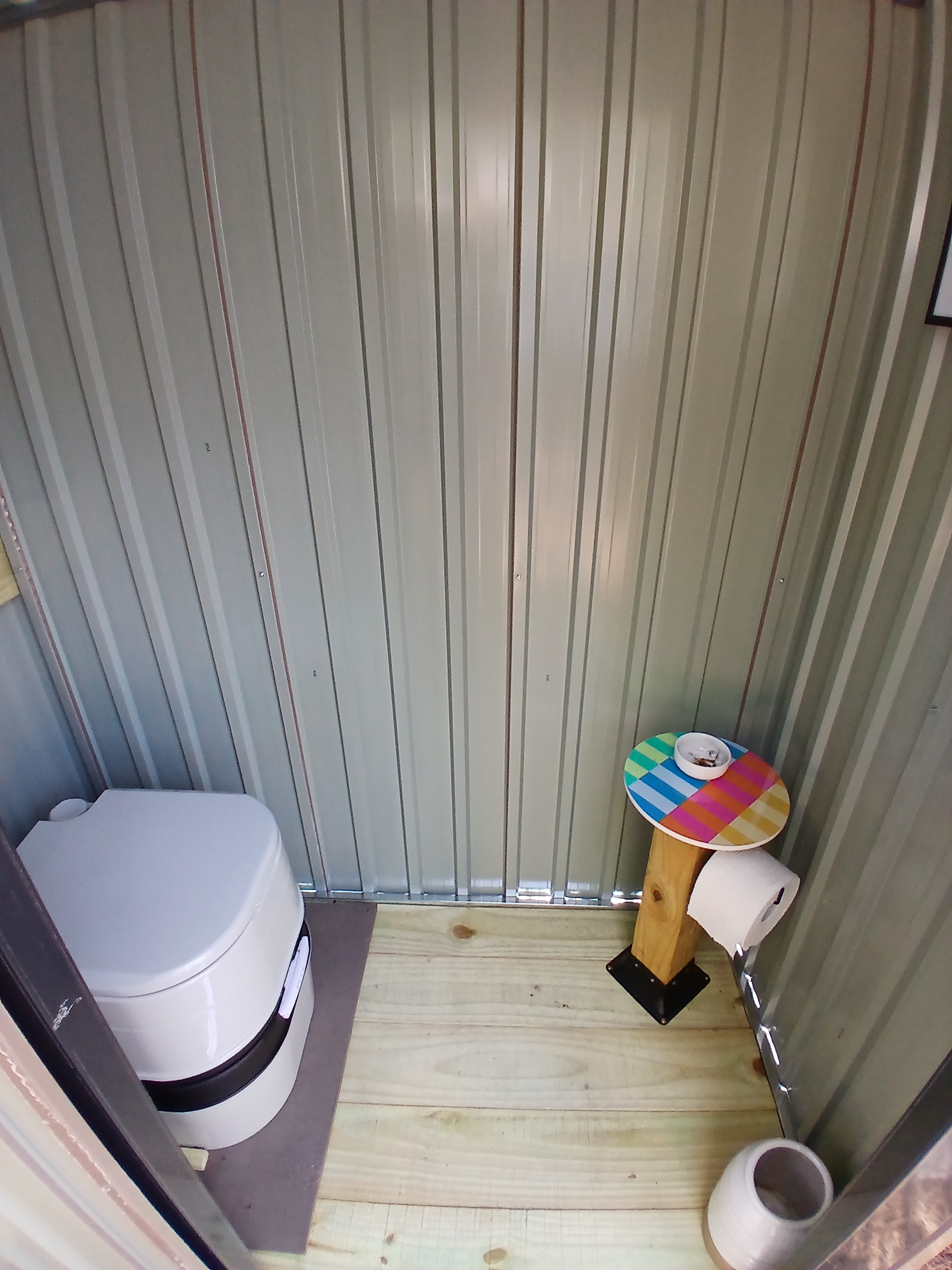 The outhouse and toilet is only a few short steps from the cabin door.