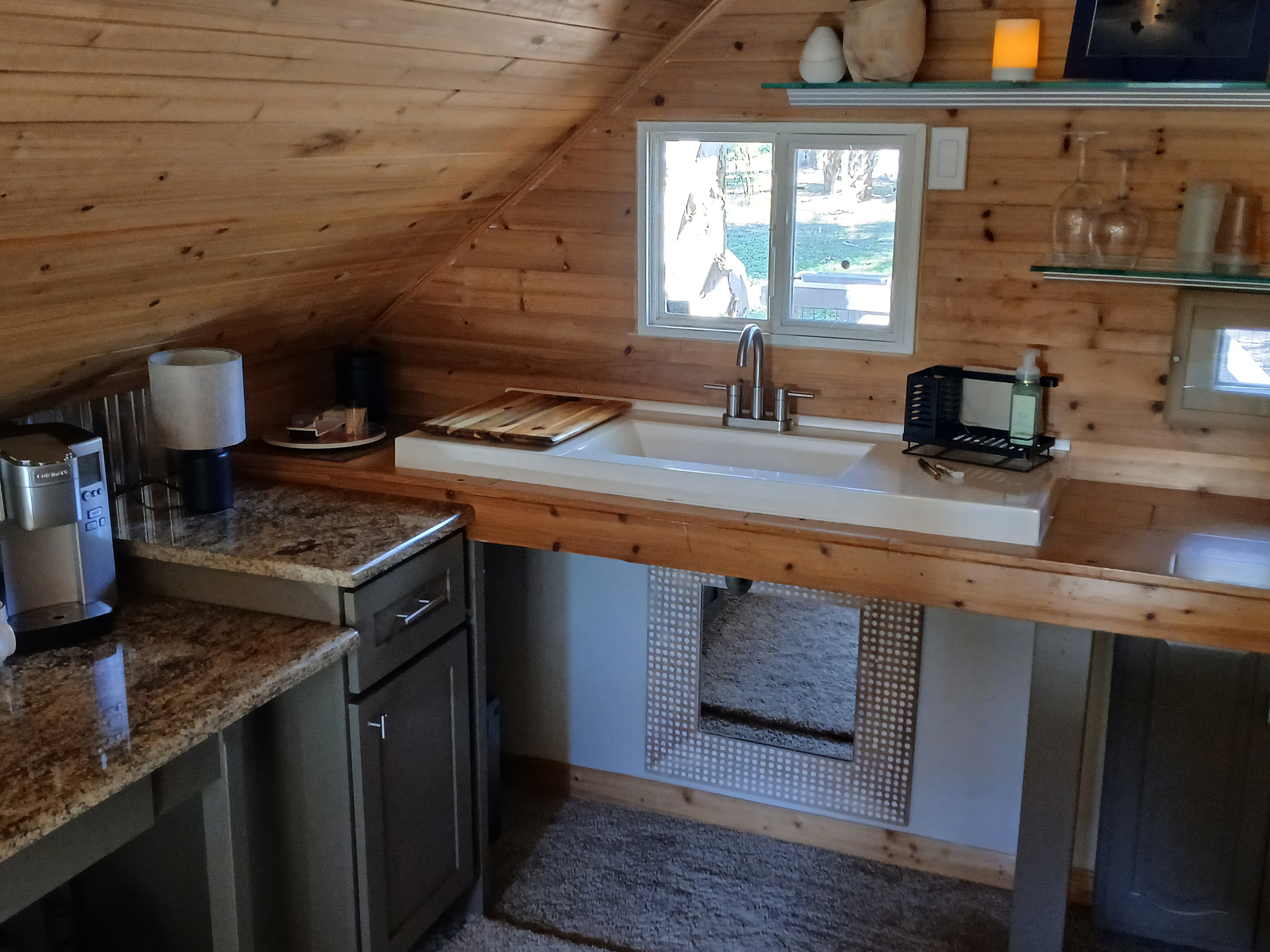 The kitchen is set up with utensils, plates and basic condiments. Outdoor cooking is done on the "Blackstone" gas griddle. Amenities include: refrigerator, microwave, coffee/espresso urn.