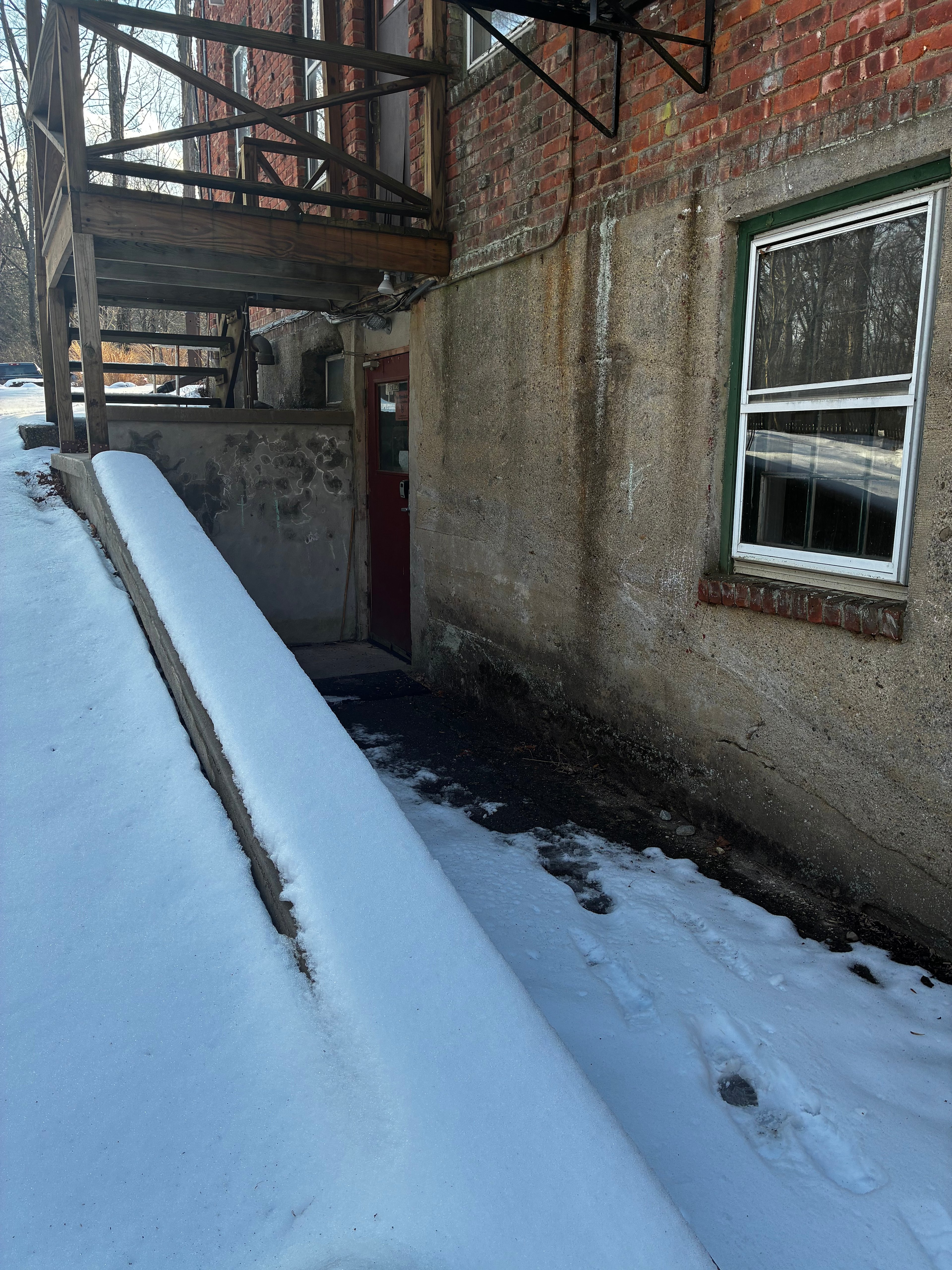 Basement access to bathrooms on right side of building.