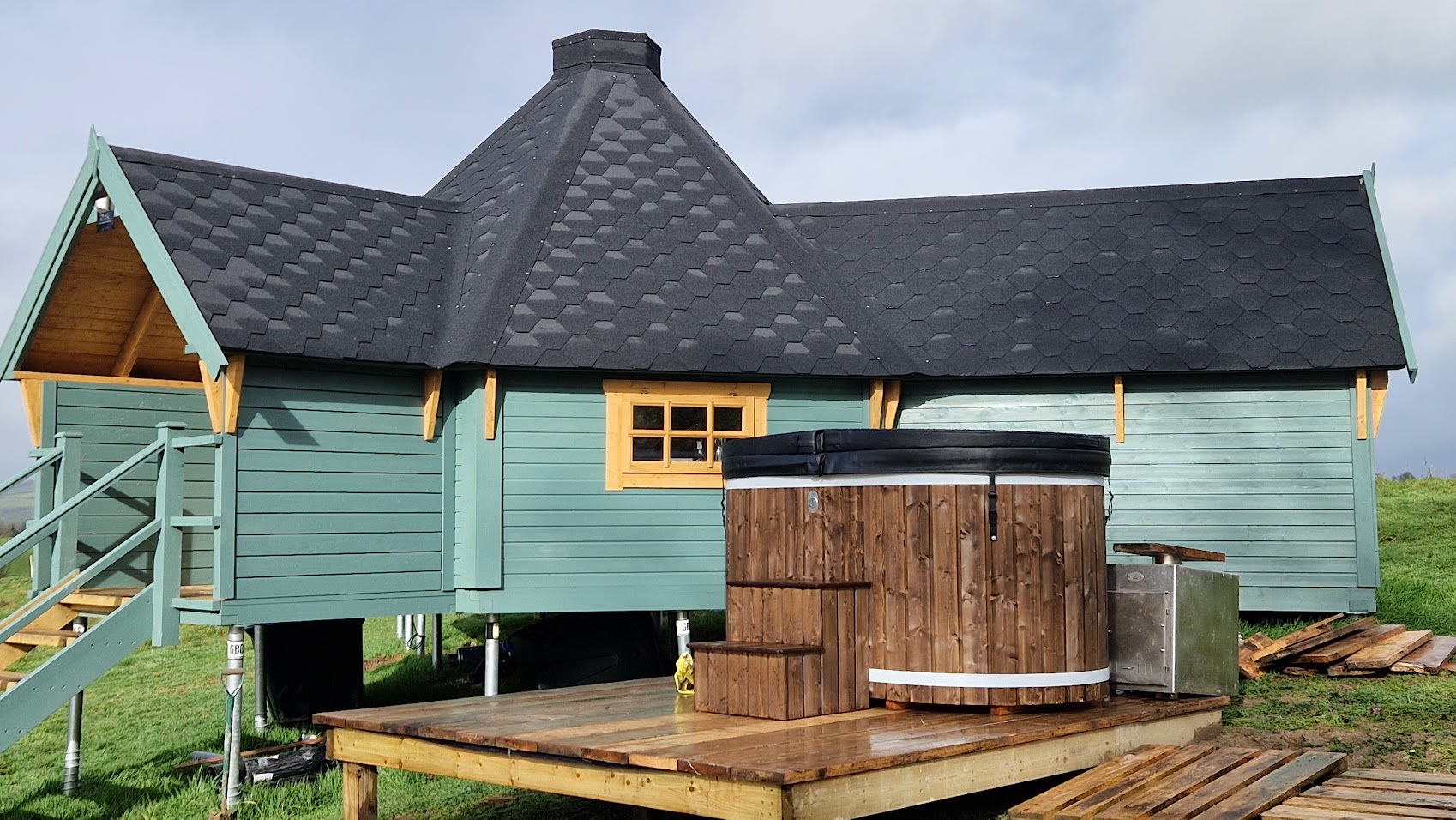 Wood fired hot tub with bubbles (before the railing is added). 