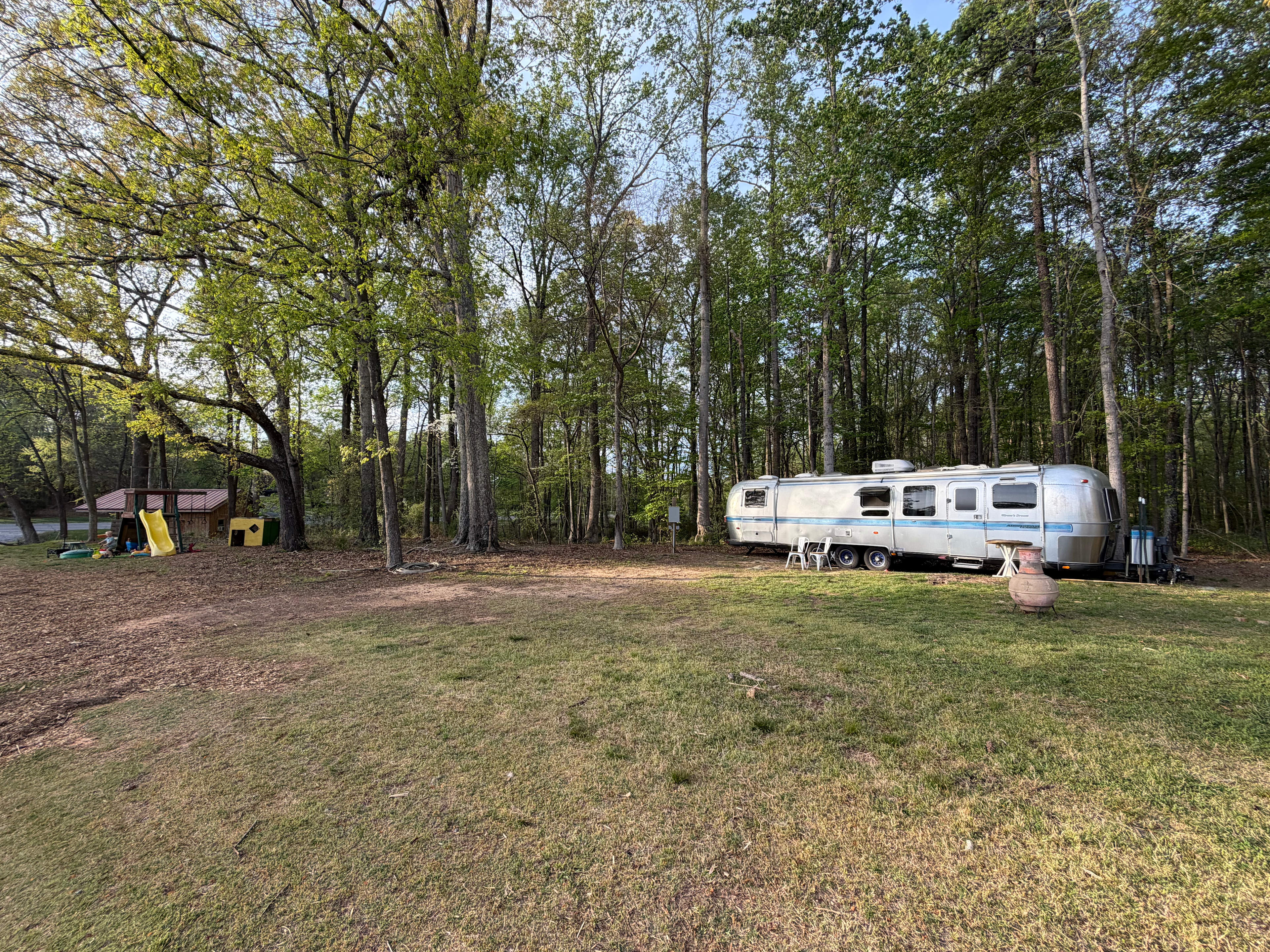 Most people park perpendicular to the airstream on the left side along the tree line. Easy 30 amp hookup access here and a great spot to roam and experience farm life!