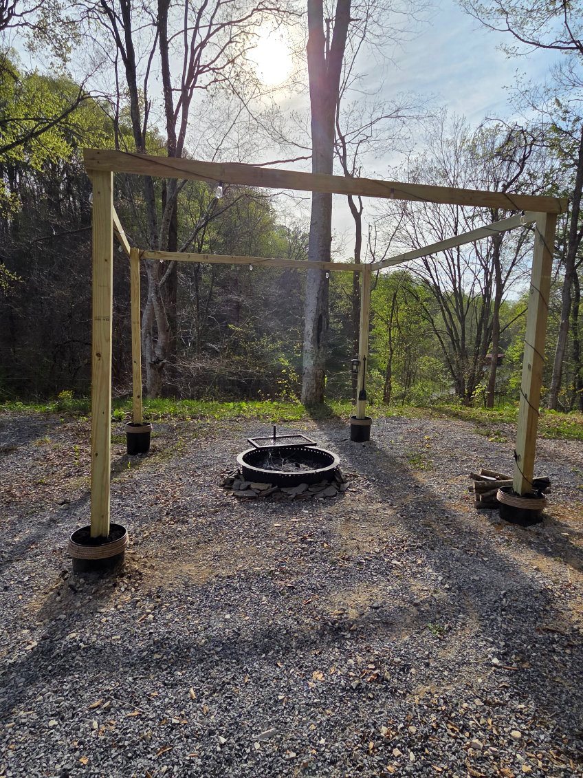 Firepit area with grill and solar string lights