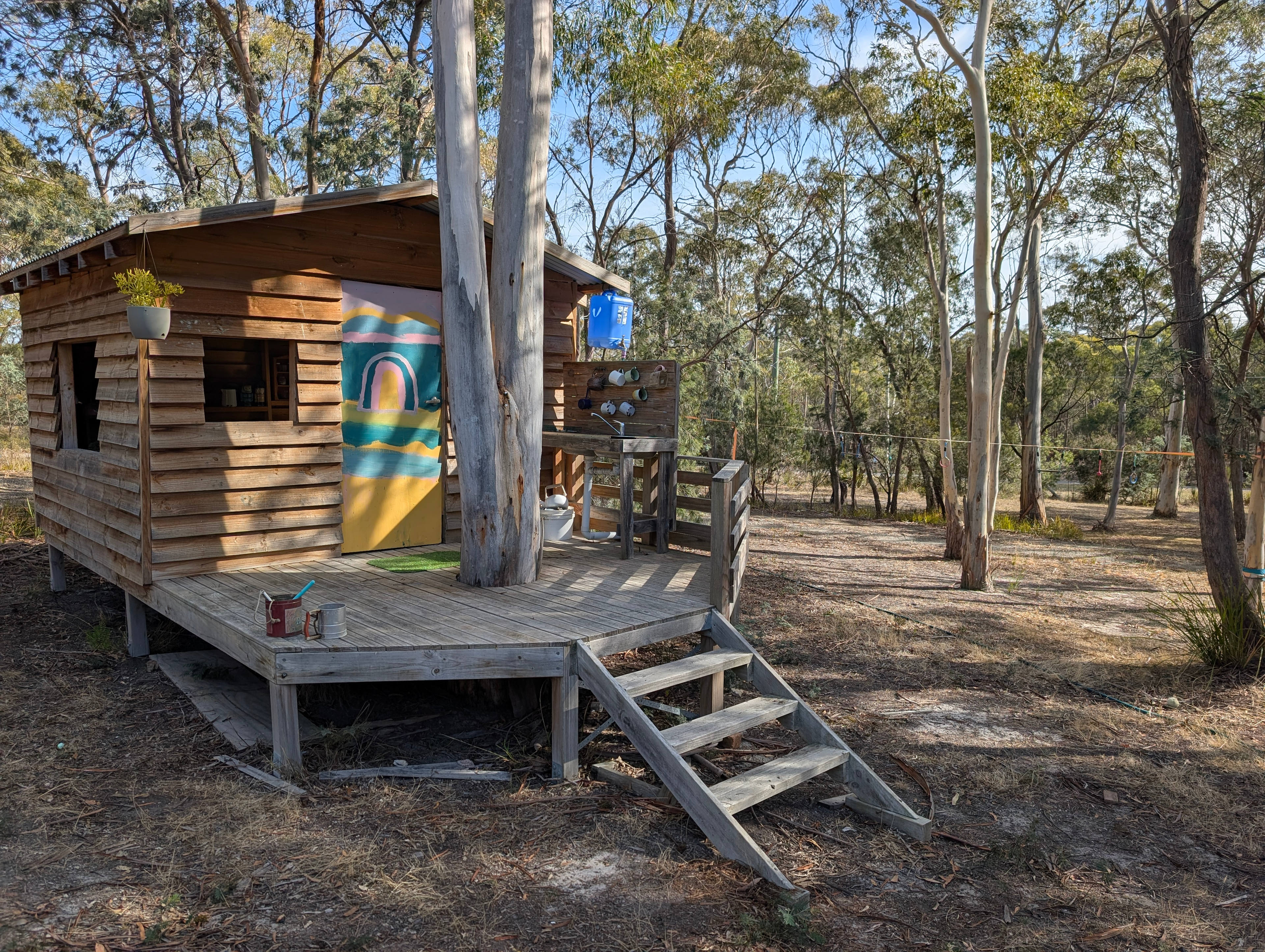 The cubby house, with campsite in the background. 