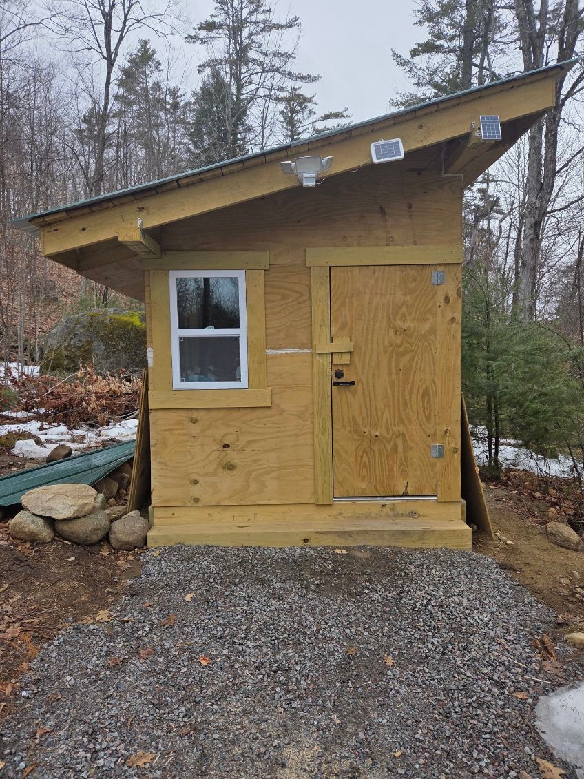 New construction communal outhouse with regular cleaning provided,