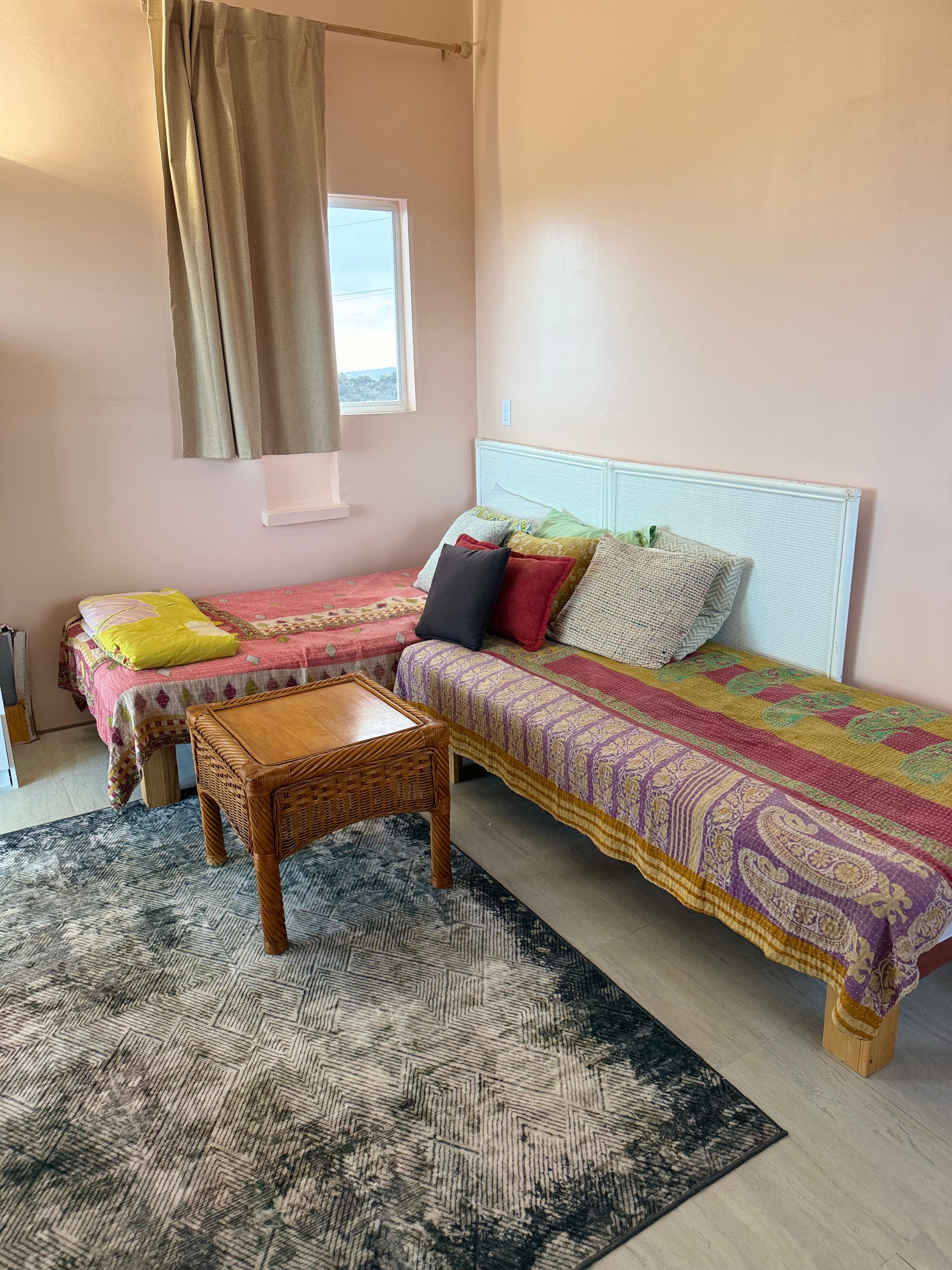 Two single beds with bedding. 