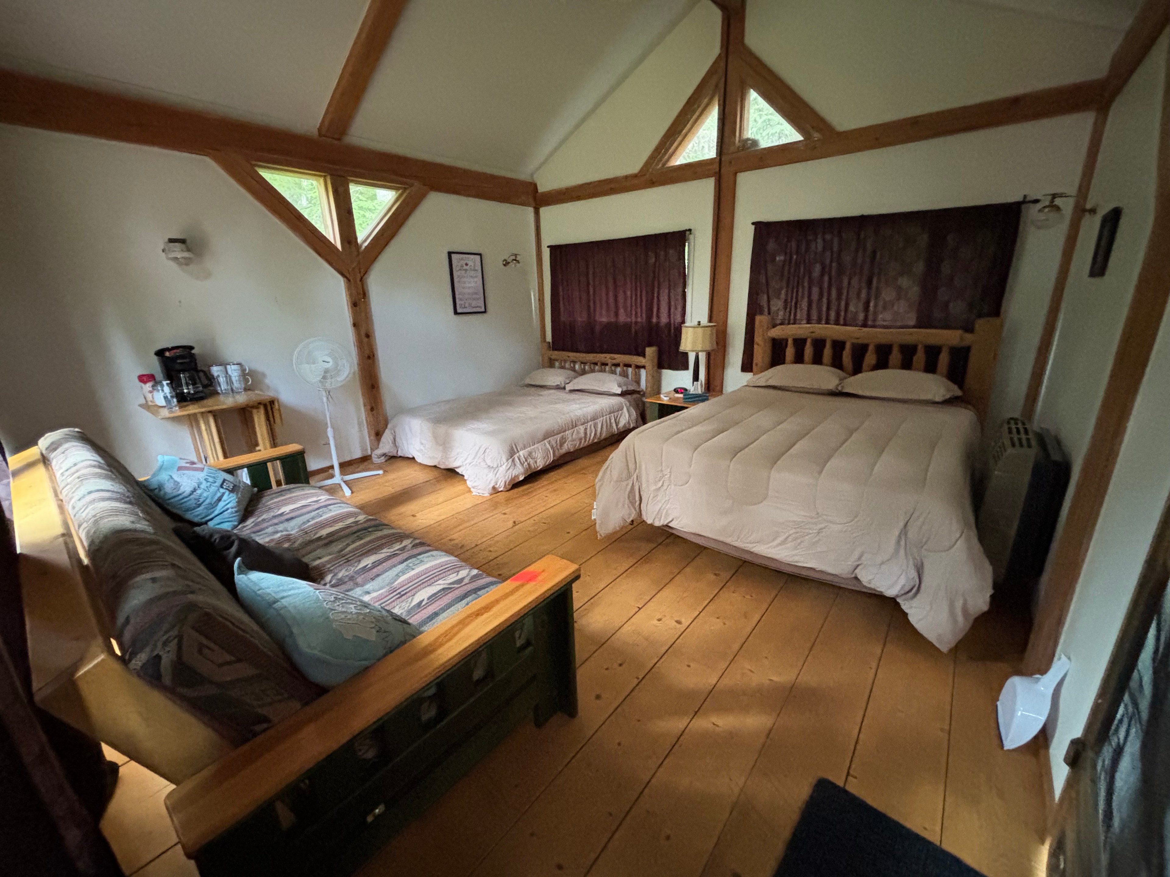 Interior of cabin 2 queen beds and a futon