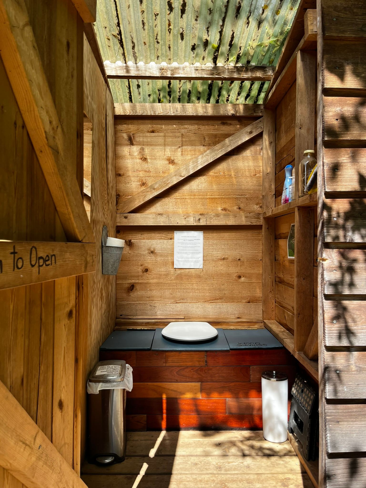 The shared outdoor compost toilet.