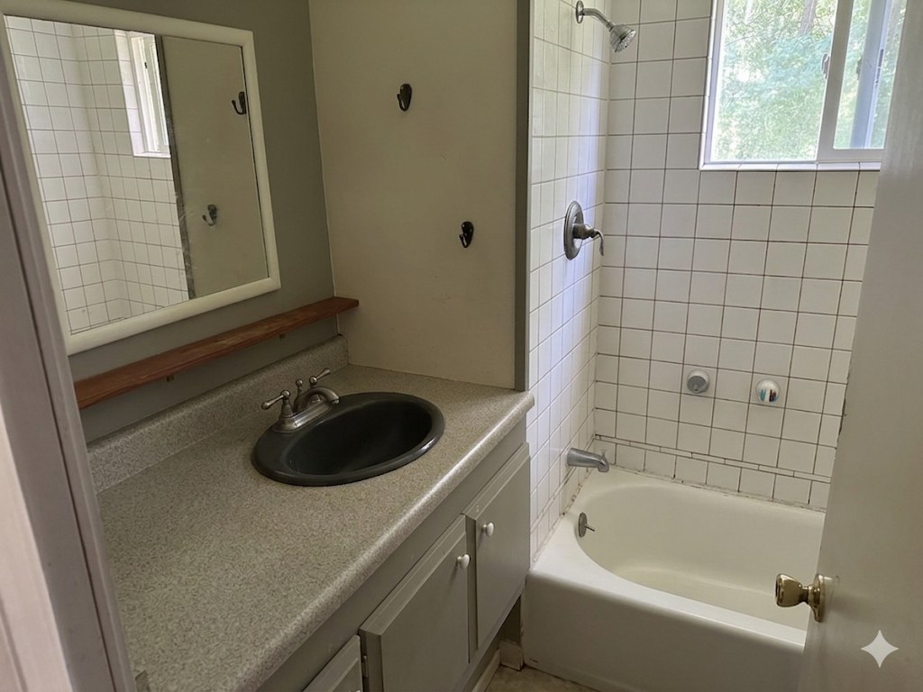 Bathroom is shared with other campers and a caretaker. Showers are limited to 5 minutes. Water via a hose is also available outside by a picnic table.
