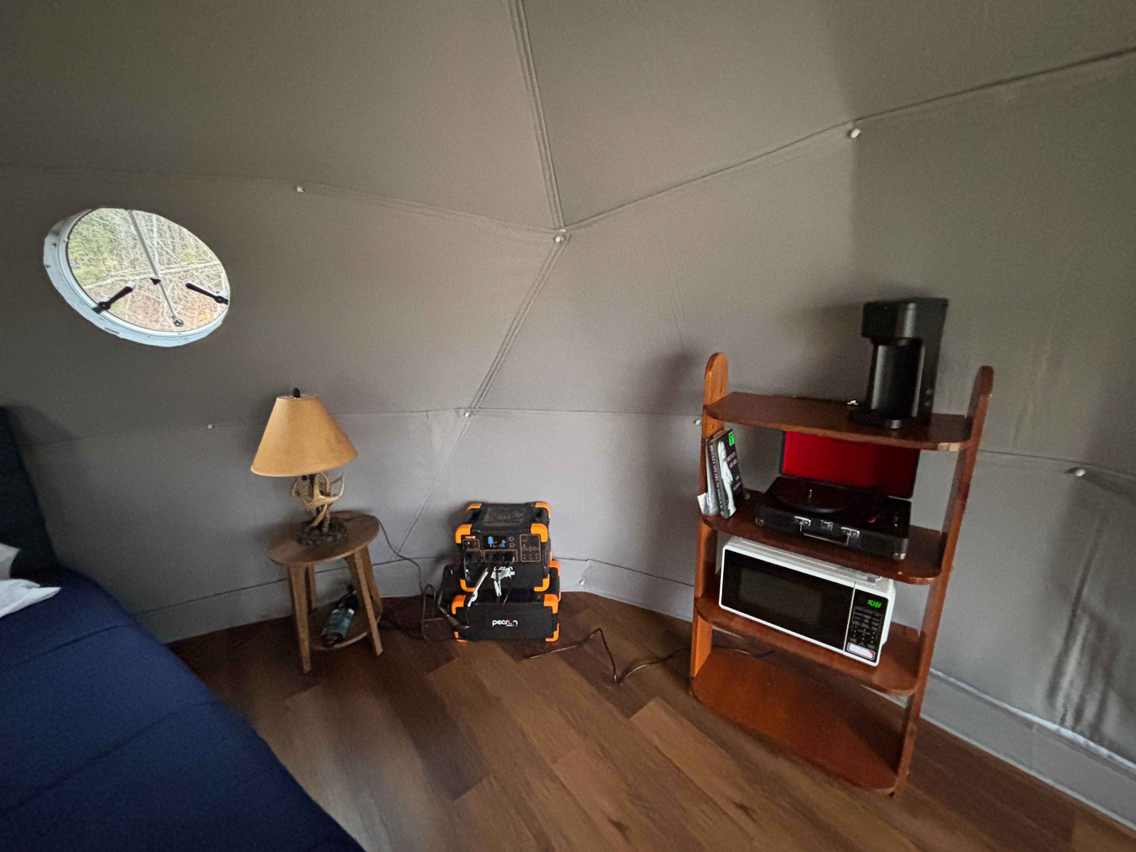 Off-grid power station, refrigerated cooler, air conditioner, microwave oven, record player, coffee station.