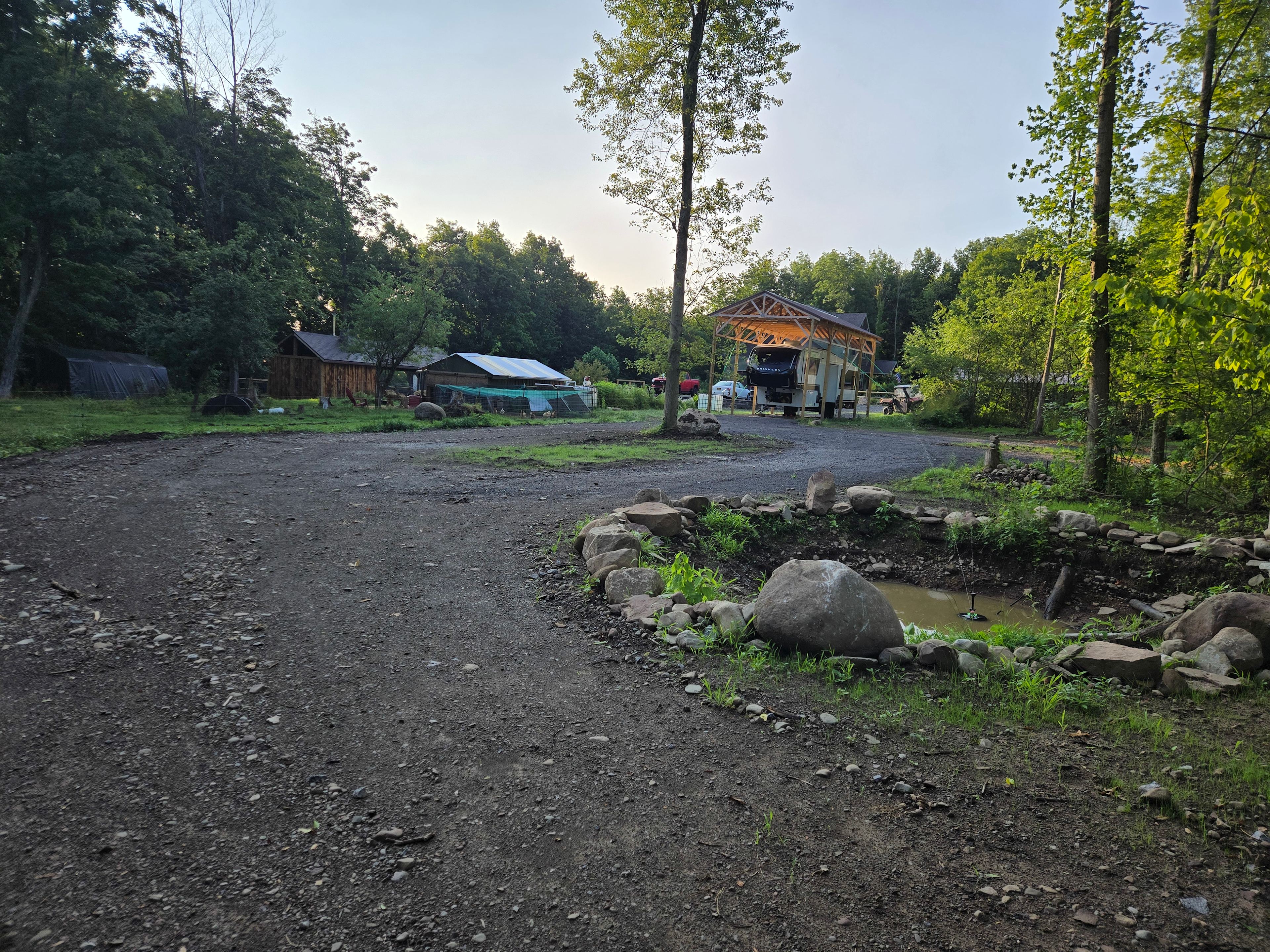 Spacious entry to the driveway as you come around Frog Pond (with fountain).