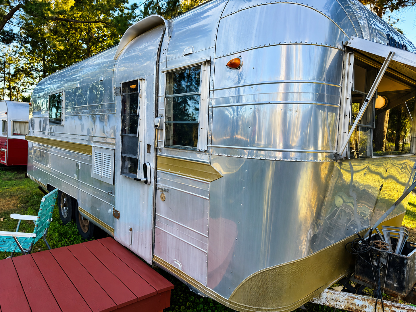 Vintage camping meets modern comfort in our Art Deco-inspired Streamline Bathhouse, just steps from your camper.