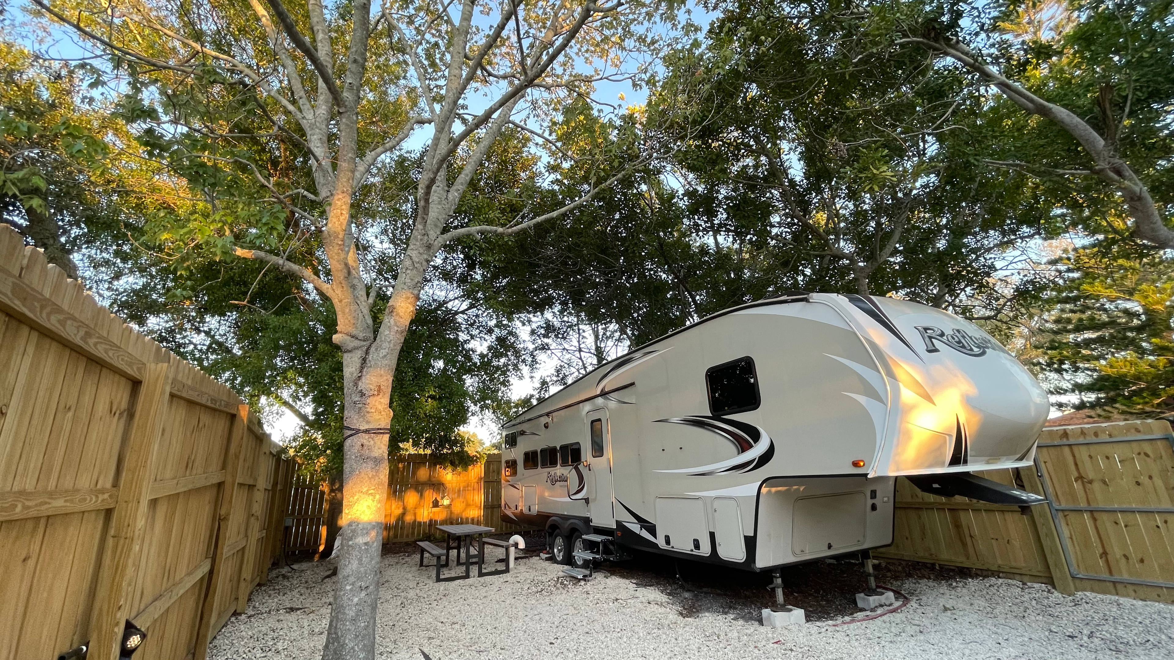 Secluded Shaded RV Oasis: AC, Hot Tub, Hammock & Fire Pit