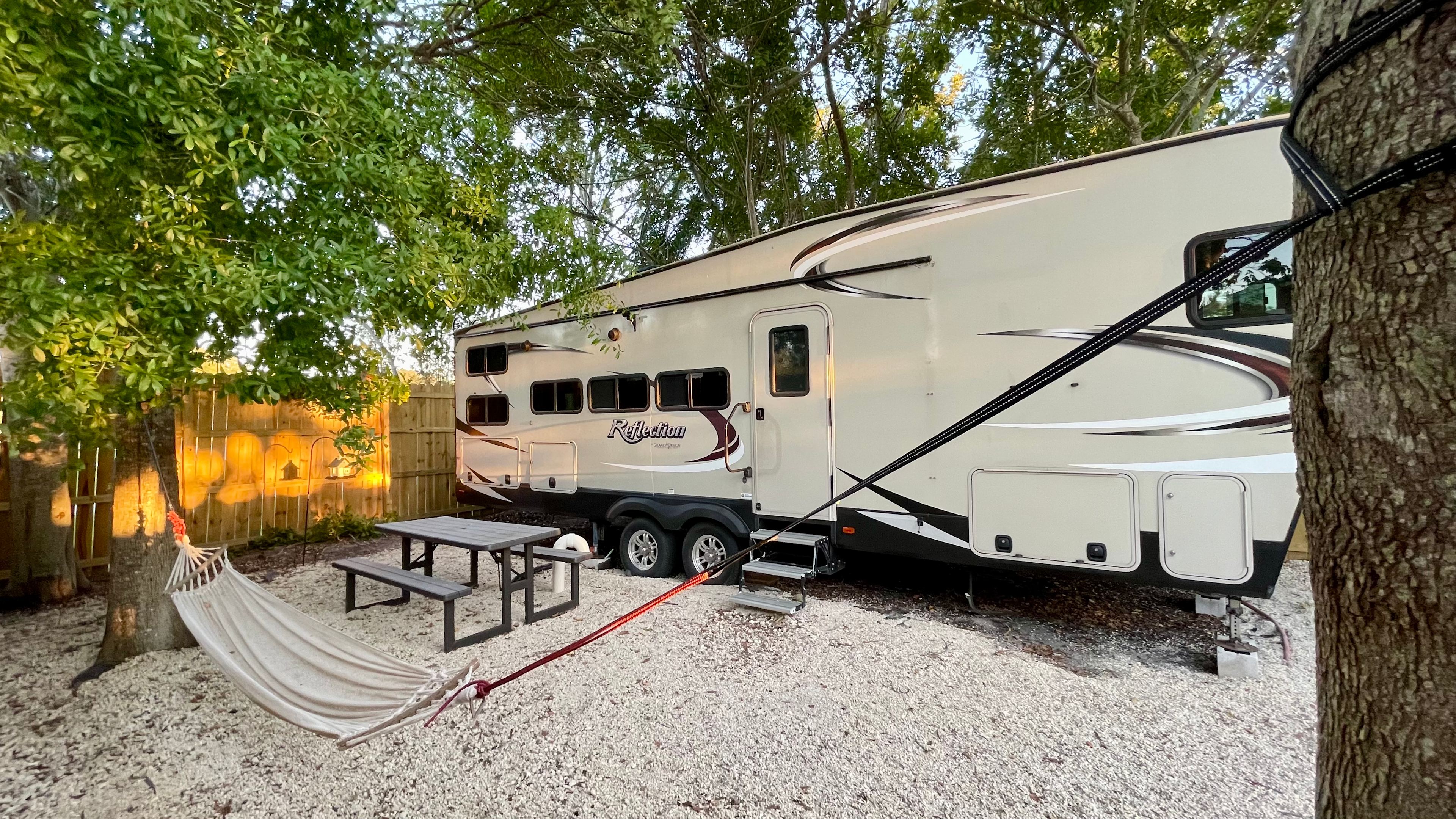 Secluded Shaded RV Oasis: AC, Hot Tub, Hammock & Fire Pit