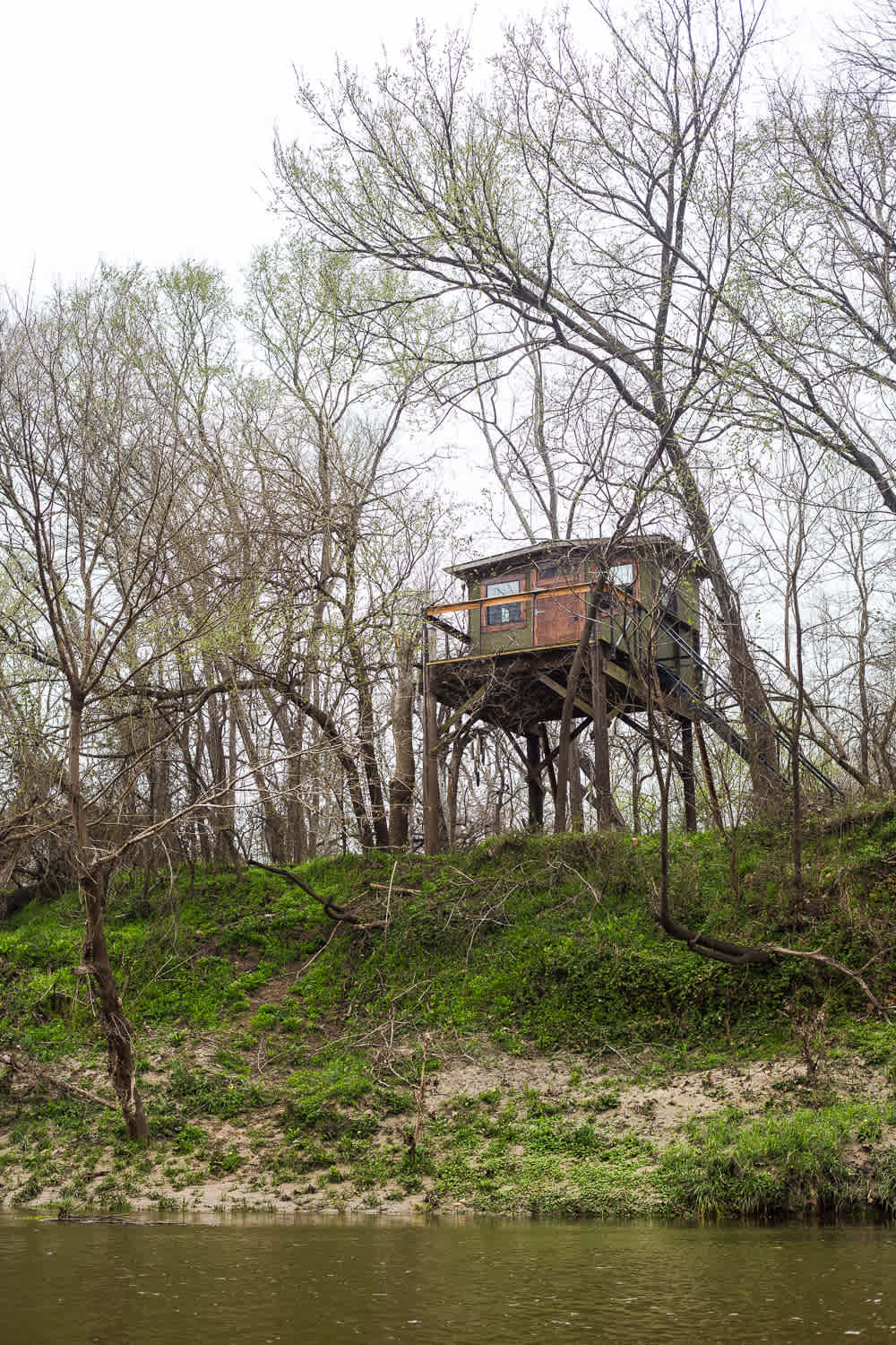 View of the beautiful treehouse from on the water.