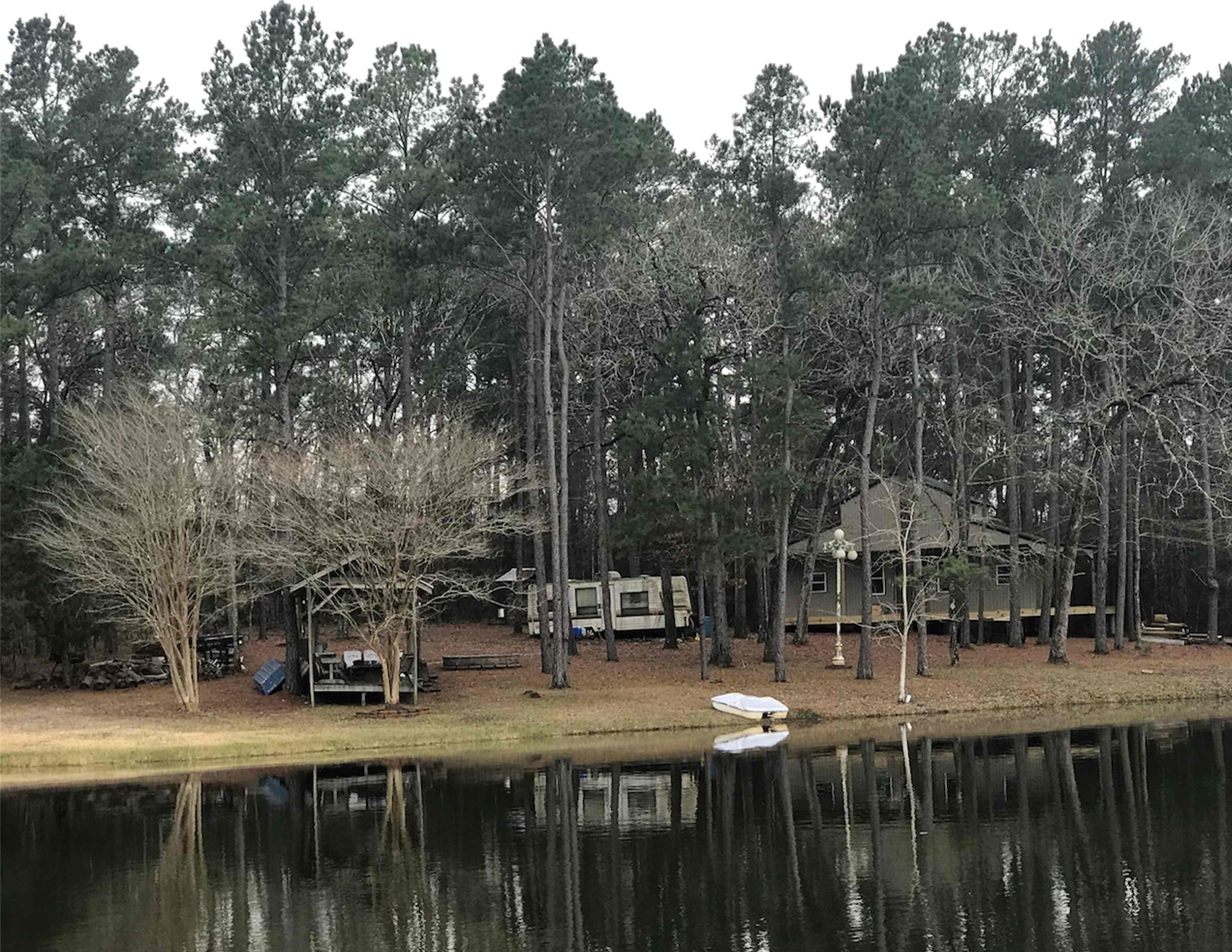 View of land from pond. The house in the background is still under construction. 