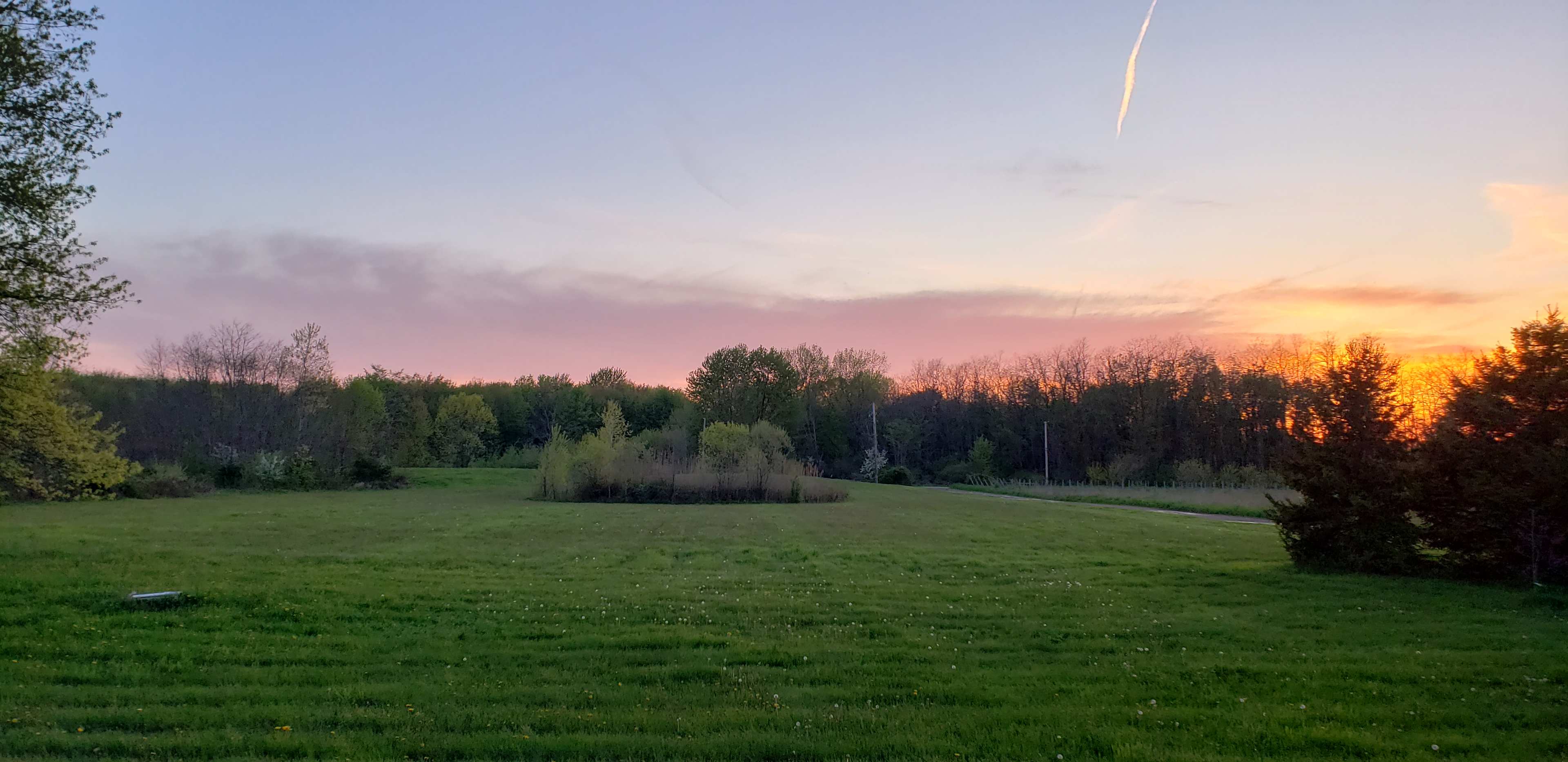 Sunset looking across the property and towards the pond.