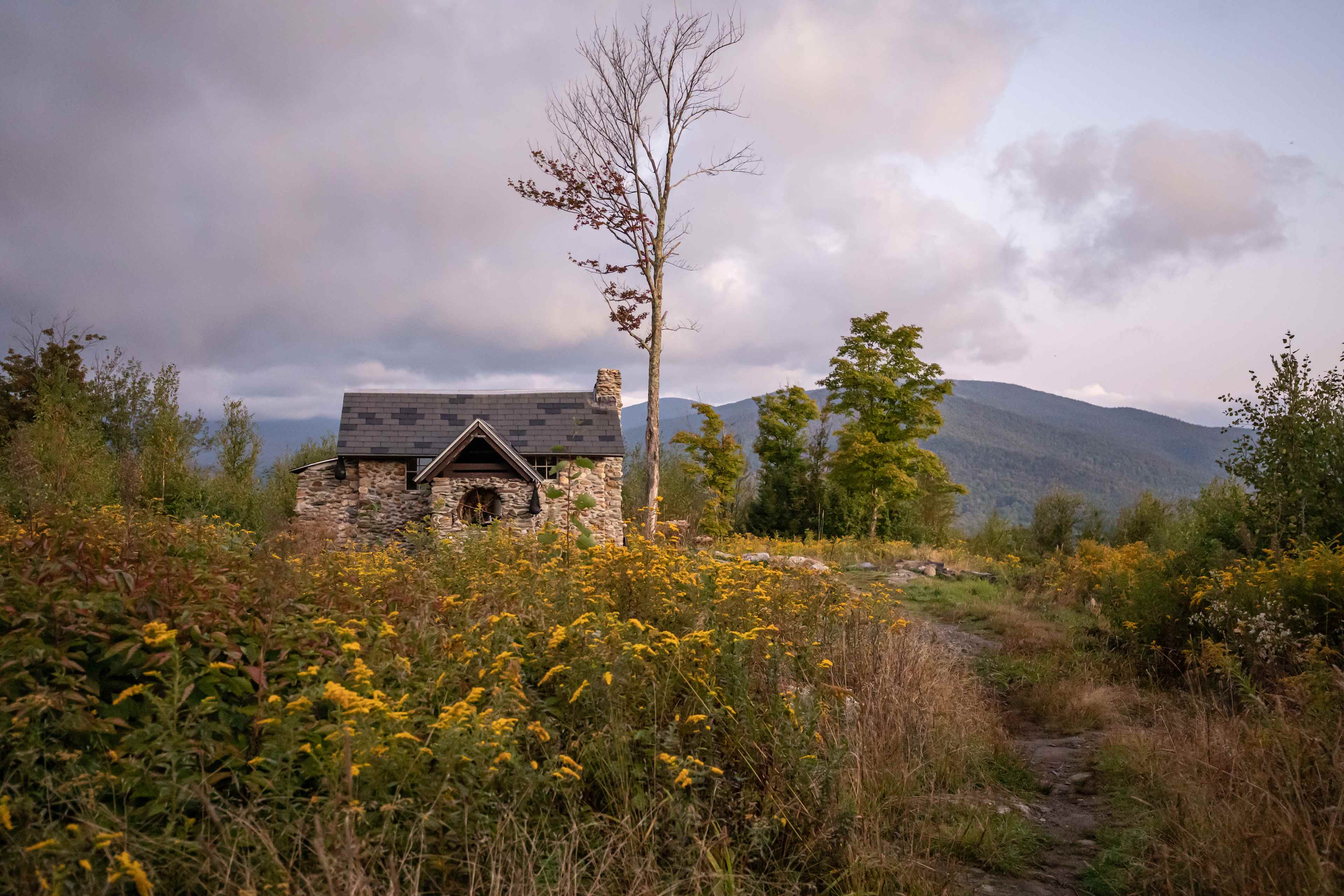looking back at the cabin from the outhouse trail during sunrise