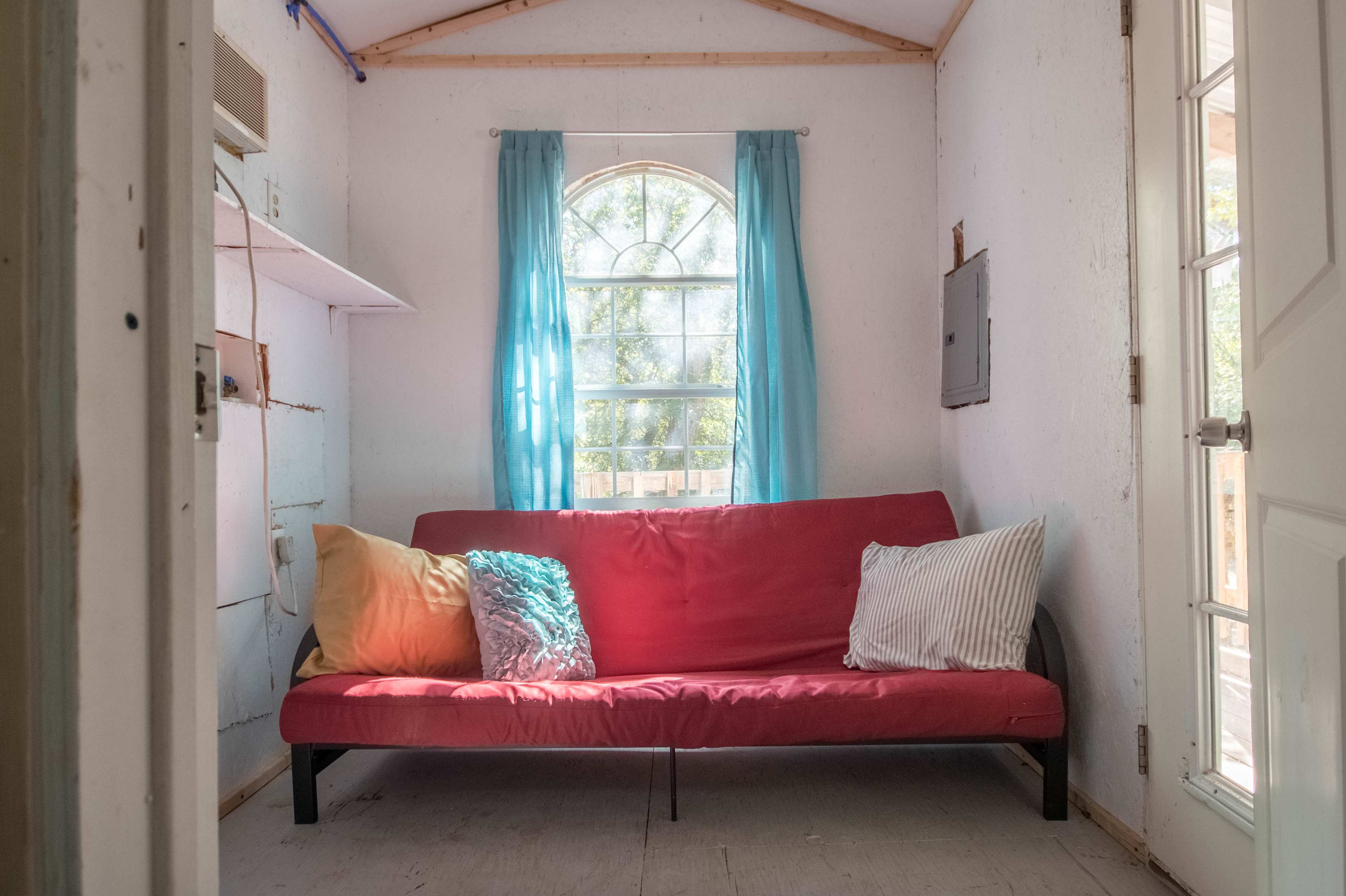 The top story had a futon and beautiful natural lighting