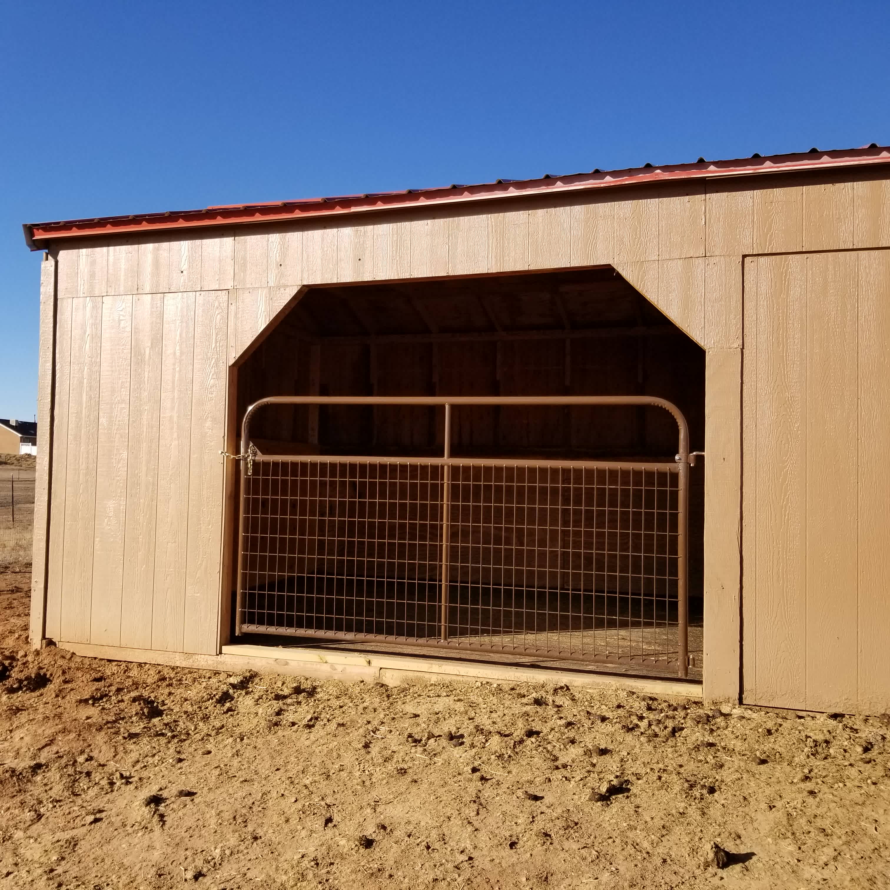 12 ft x 12 ft matted horse shelter. You can keep your horse gated in or secure gate to the inside of shelter to allow them open access to the large fenced paddock.