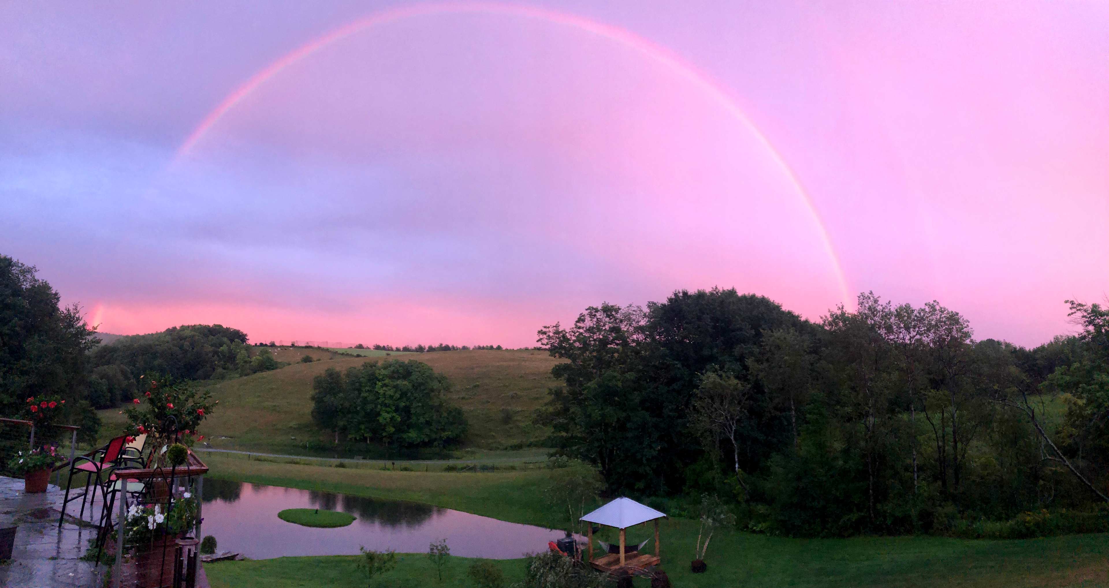View from the Outhouse, Gardens, Hopsyard, Hiking Trails & Wooded Camp Sites are in the hills beyond.