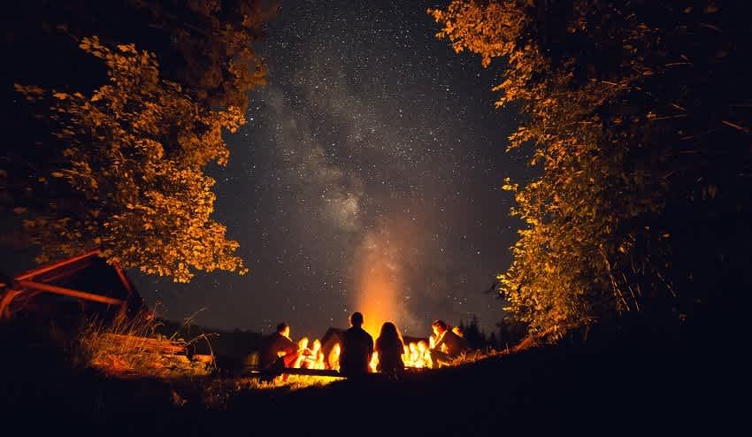 Night sky around fire