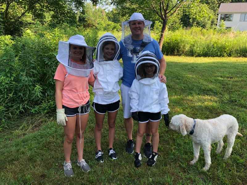 Camper getting ready for the bee tour. 