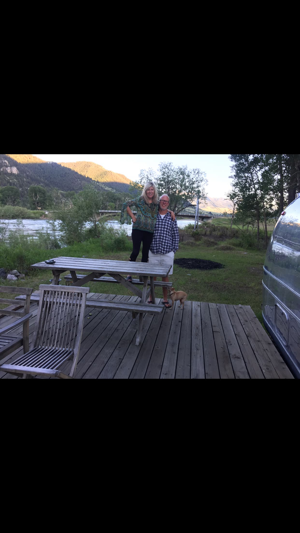 Sitting on our property in front of the Yellowstone River On our wooden deck 