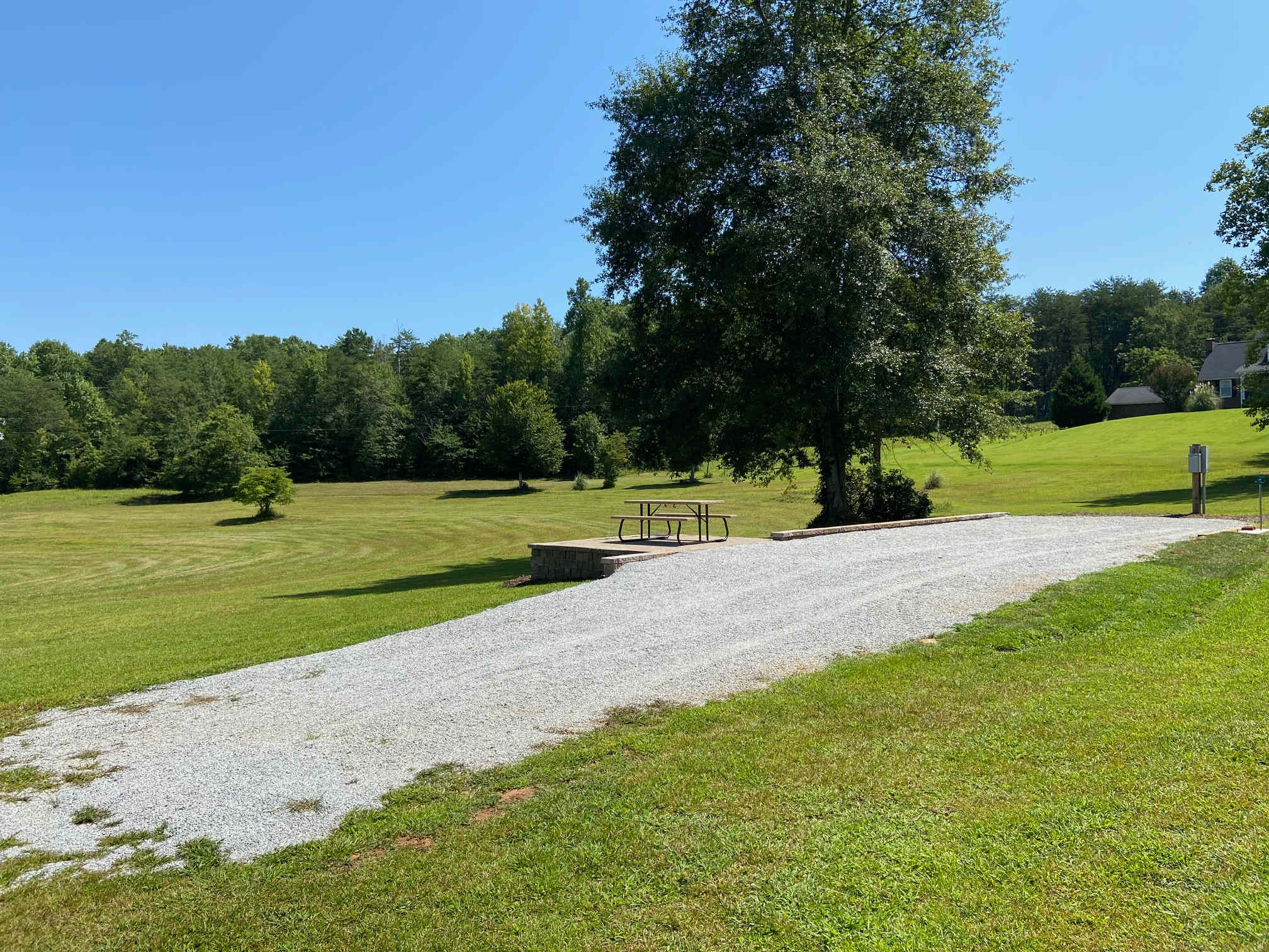 In this photo you can see the corner of my house.  My wife along with my daughter and grand daughter reside here.   Our house is about 100 yards from the camp site.  