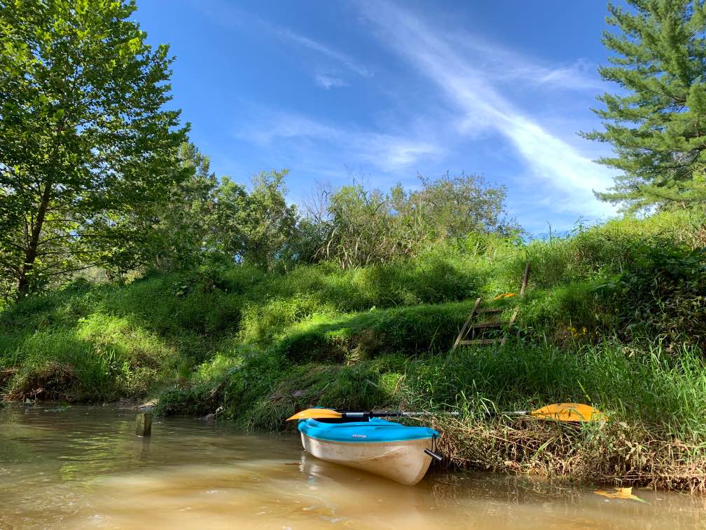 The riverbank is groomed, but very natural in the moment.  River sandals are handy-- there are some shallow areas to explore and its fun to get out and walk!!  