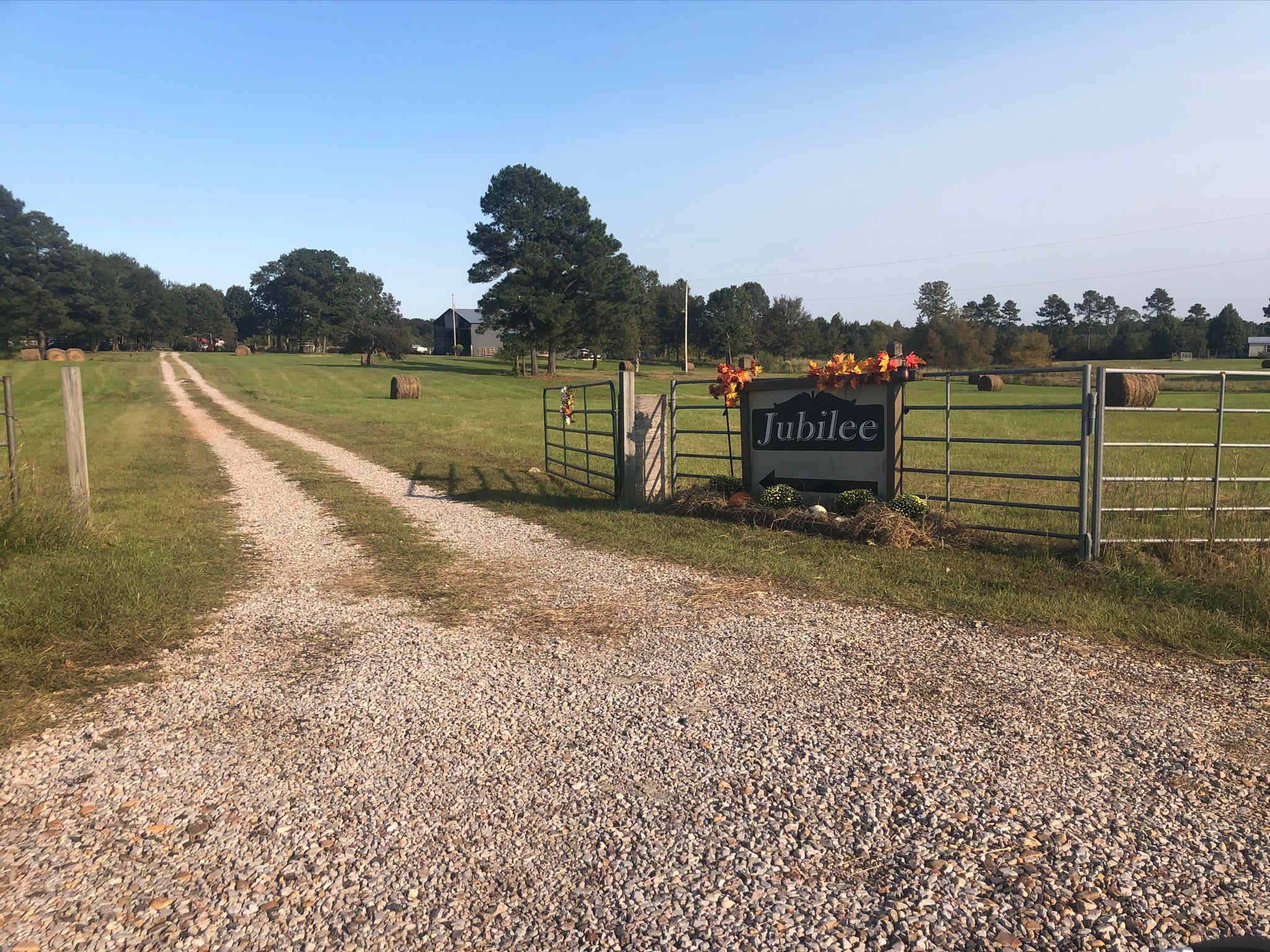 Entrance sign and long friveway