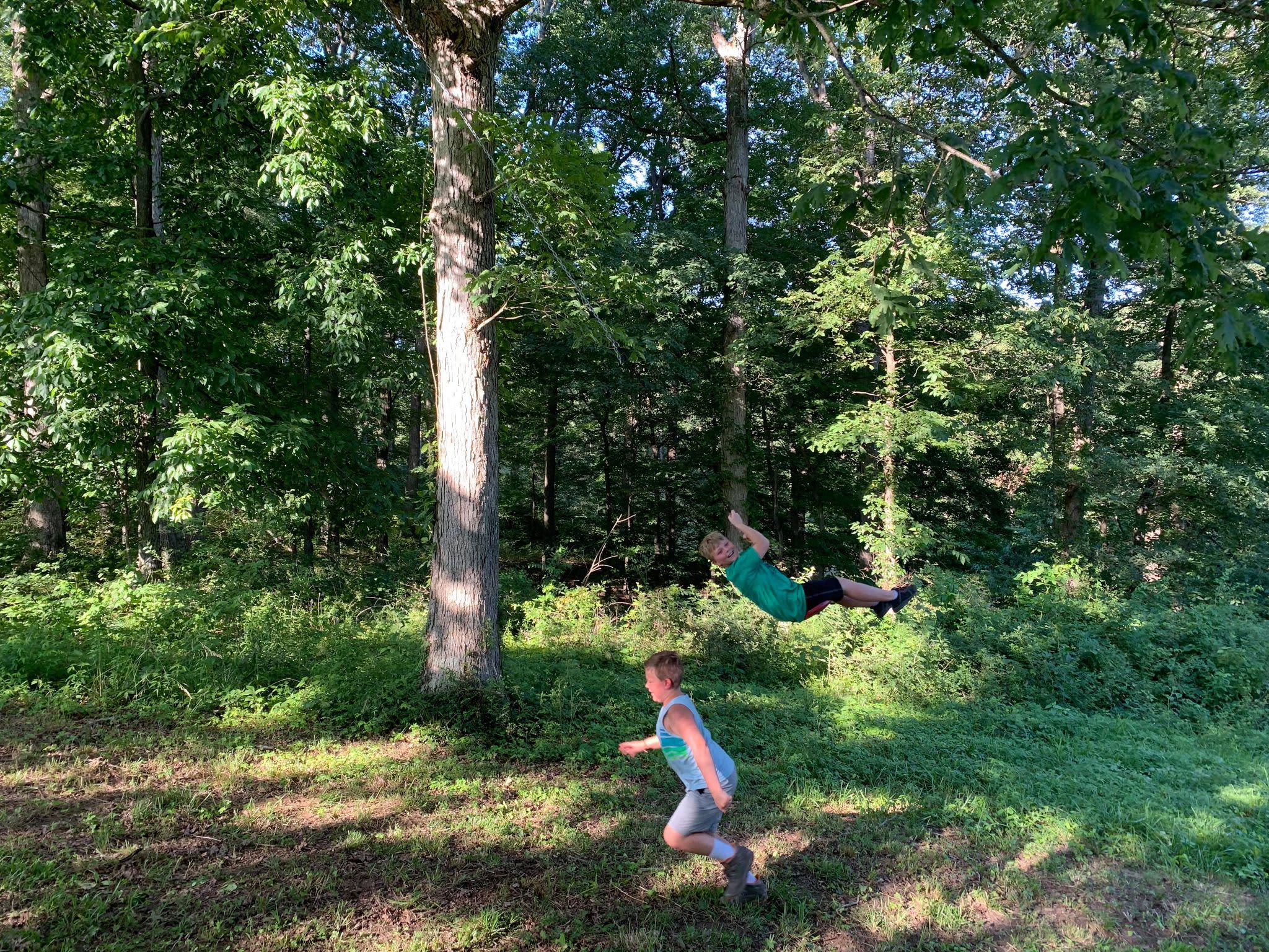 The kids having fun on the tree swing. Campsite #1