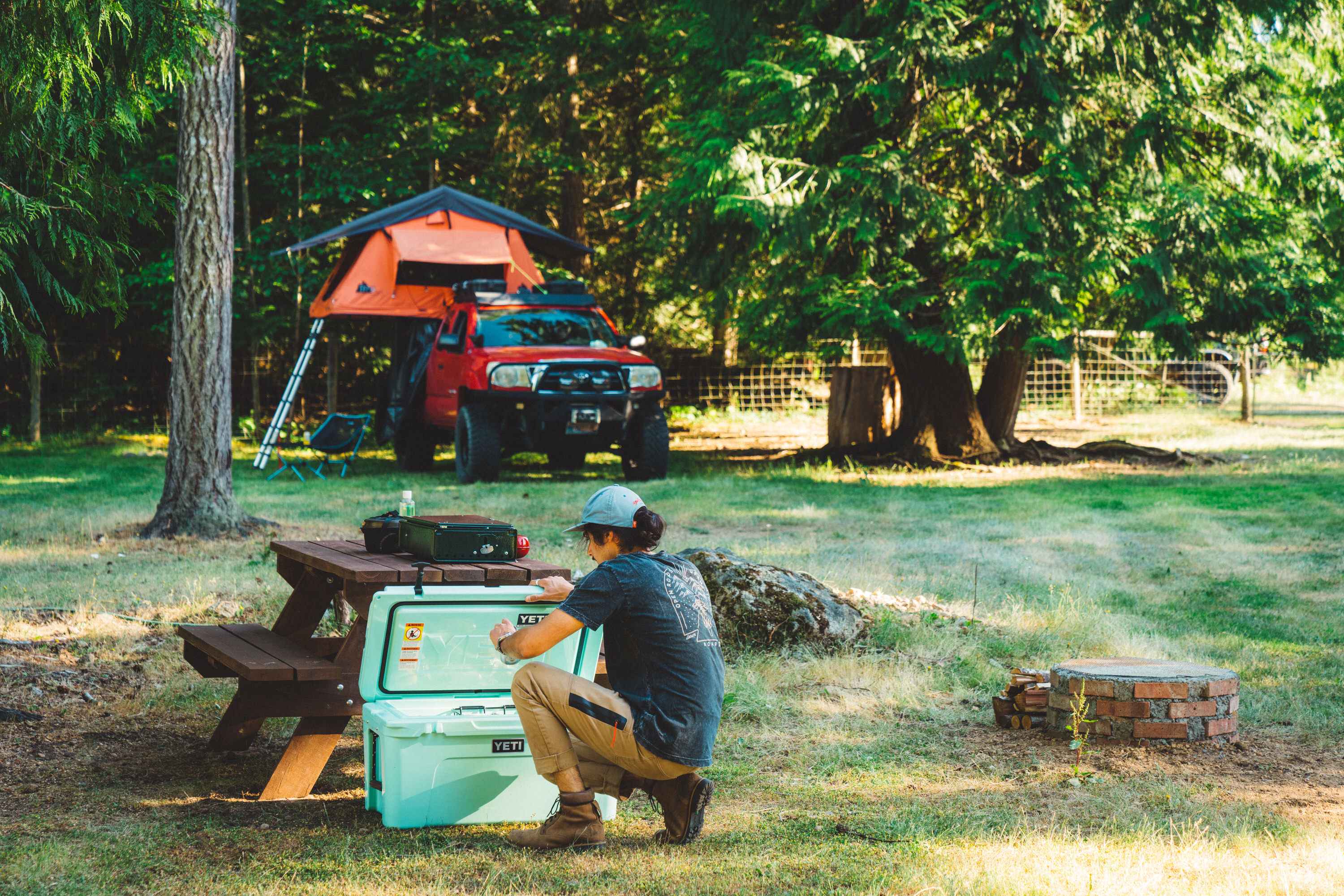 My site near the donkeys with provided picnic table and firepit in view.