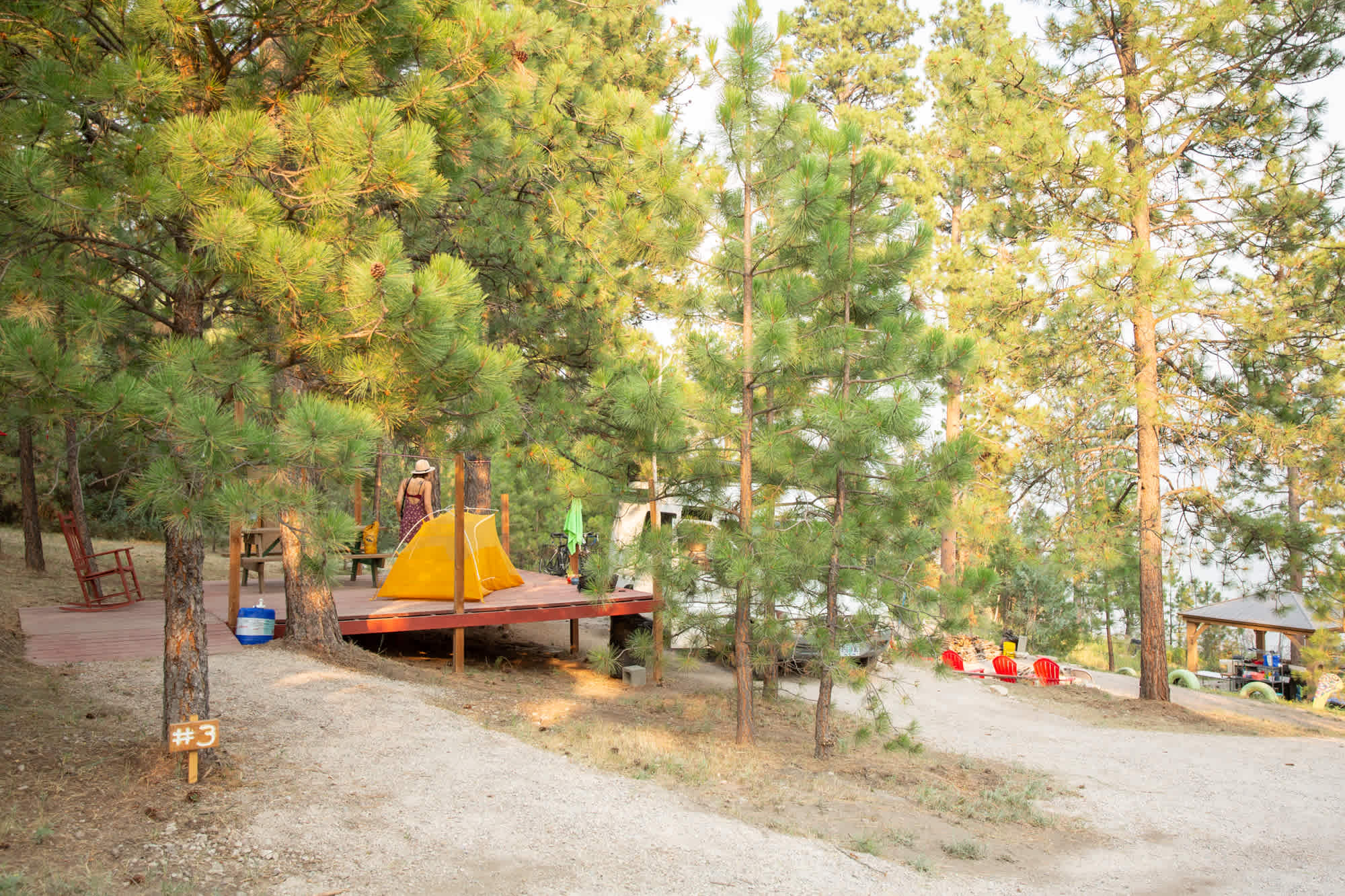 On the platform is a picnic table, personal grill and rocking chair.
