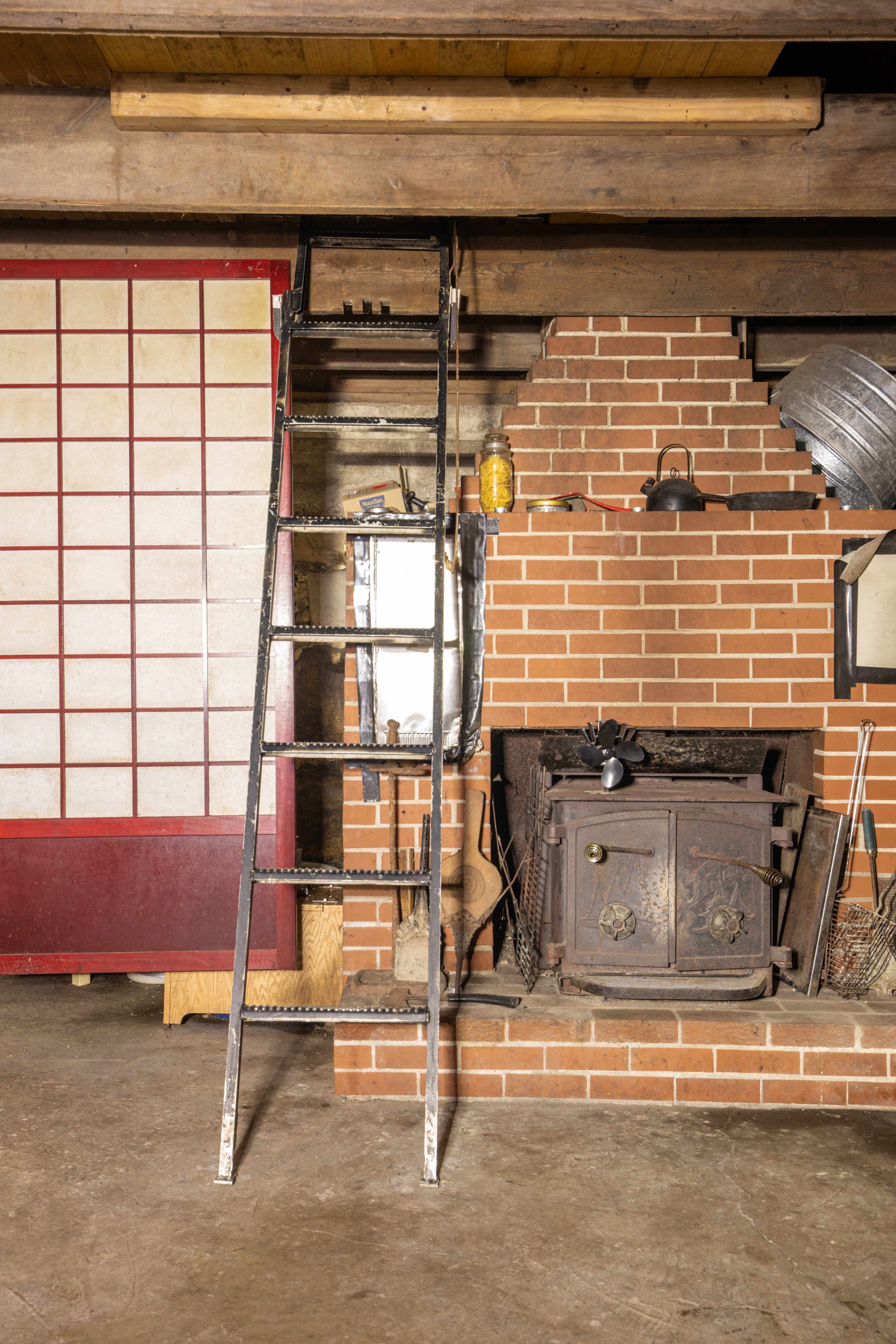 The sleeping area can be accessed via this cool old metal ladder.