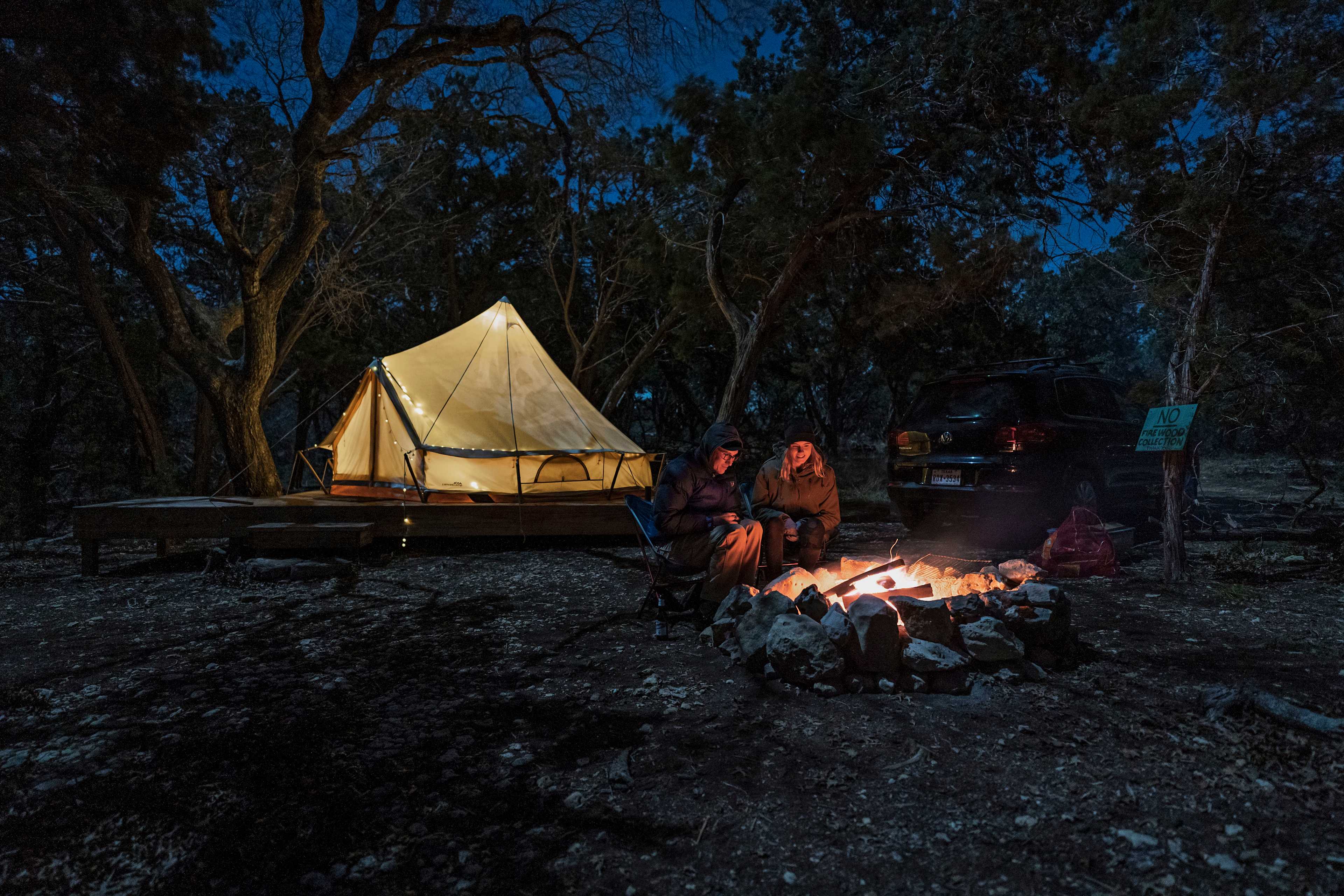 Campfire conversations under a clear night sky.
