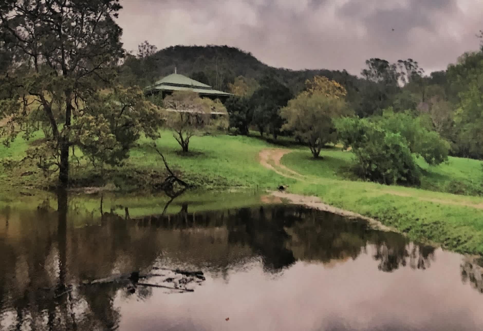 The farm house,  your camp is through another gate in the valley beyond.