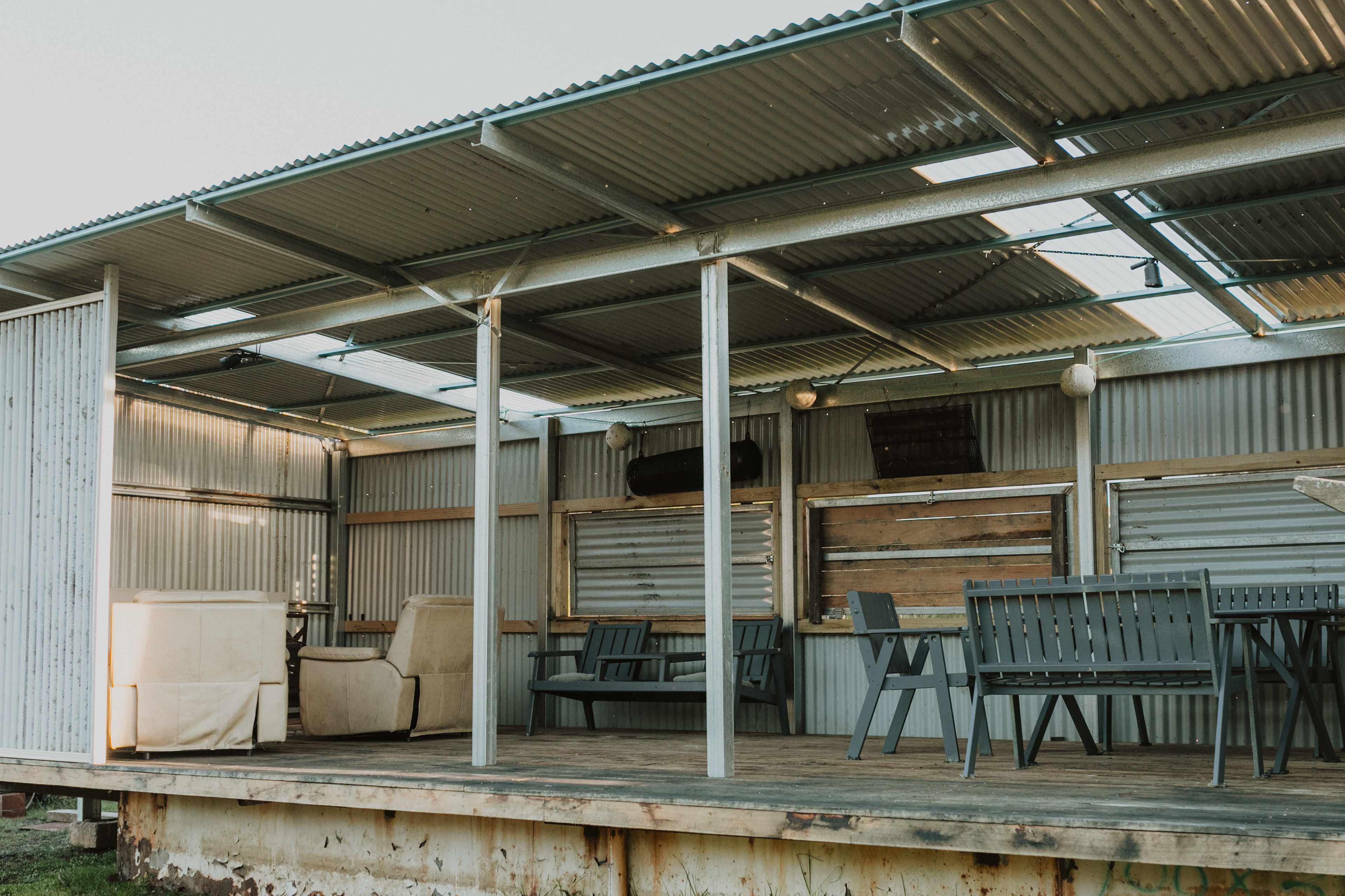 The shed where you can relax, sit around the table, enjoy a fire, play some darts...